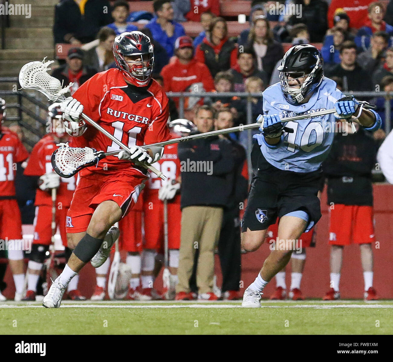 Piscataway, NJ, USA. 2nd Apr, 2016. Austin Spencer (40) tries to defend Jeff George (11) during an NCAA Lacrosse game between the Johns Hopkins Blue Jays and the Rutgers Scarlet Knights at High Point Solutions Stadium in Piscataway, NJ. Rutgers defeated Johns Hopkins 16-9. Mike Langish/Cal Sport Media. © csm/Alamy Live News Stock Photo