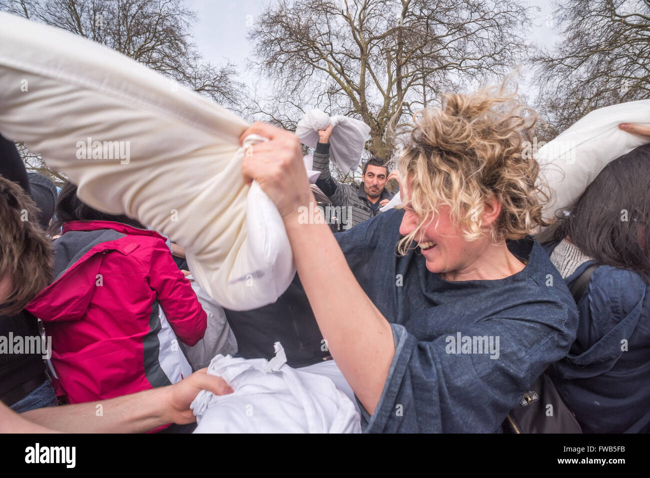 London, UK. 2nd April, 2016. Hundreds come armed with pillows to take part in a giant pillow fight despite official attempts to stop this annual event, moved at 24 hours notice to Kennington Park. A few left when police told them the event was cancelled, but most stayed to enjoy the fight.  This was the 9th year of similar massive pillow fights in over 50 other cities around the world inspired by the urban playground movement, claiming cities are public spaces for people. Peter Marshall/Alamy Live News Stock Photo