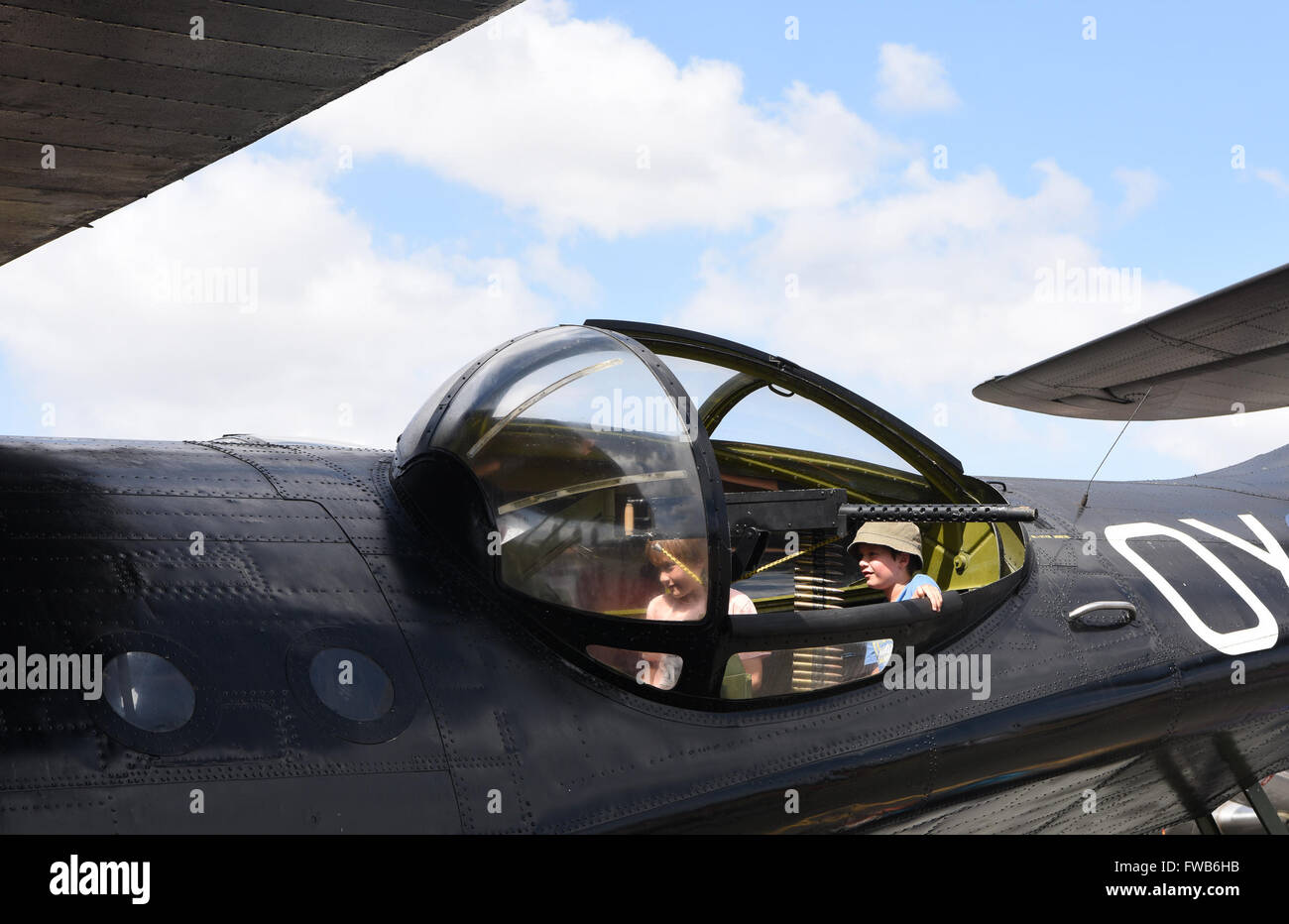Canberra, Australia. 3rd Apr, 2016. Two children visit in the cockpit of a Royal Australian Airforce aircraft on display during the Canberra Airport Open Day in Canberra, Australia, April 3, 2016. Credit:  Justin Qian/Xinhua/Alamy Live News Stock Photo