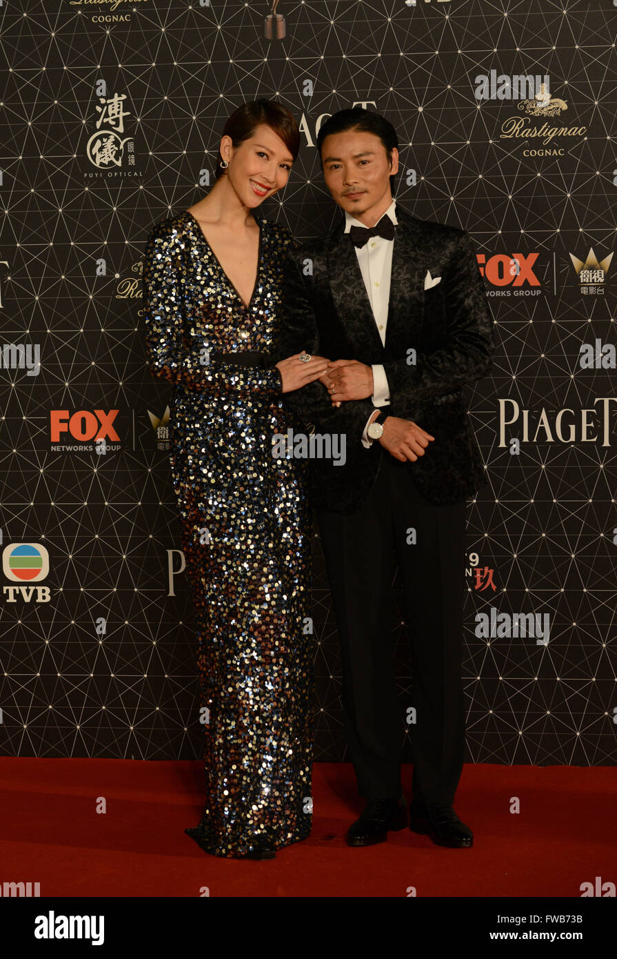 Hong Kong, China. 3rd Apr, 2016. Actress Ada Choi (L) and her husband Zhang Jin pose on the red carpet before the 35th Hong Kong Film Awards presentation ceremony in Hong Kong, south China, April 3, 2016. © Liu Yun/Xinhua/Alamy Live News Stock Photo