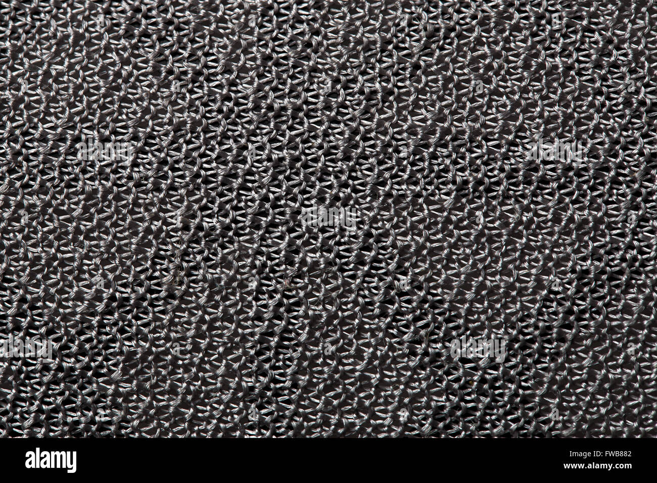 texture background of the gray mesh material, like a metal chain mail Stock Photo