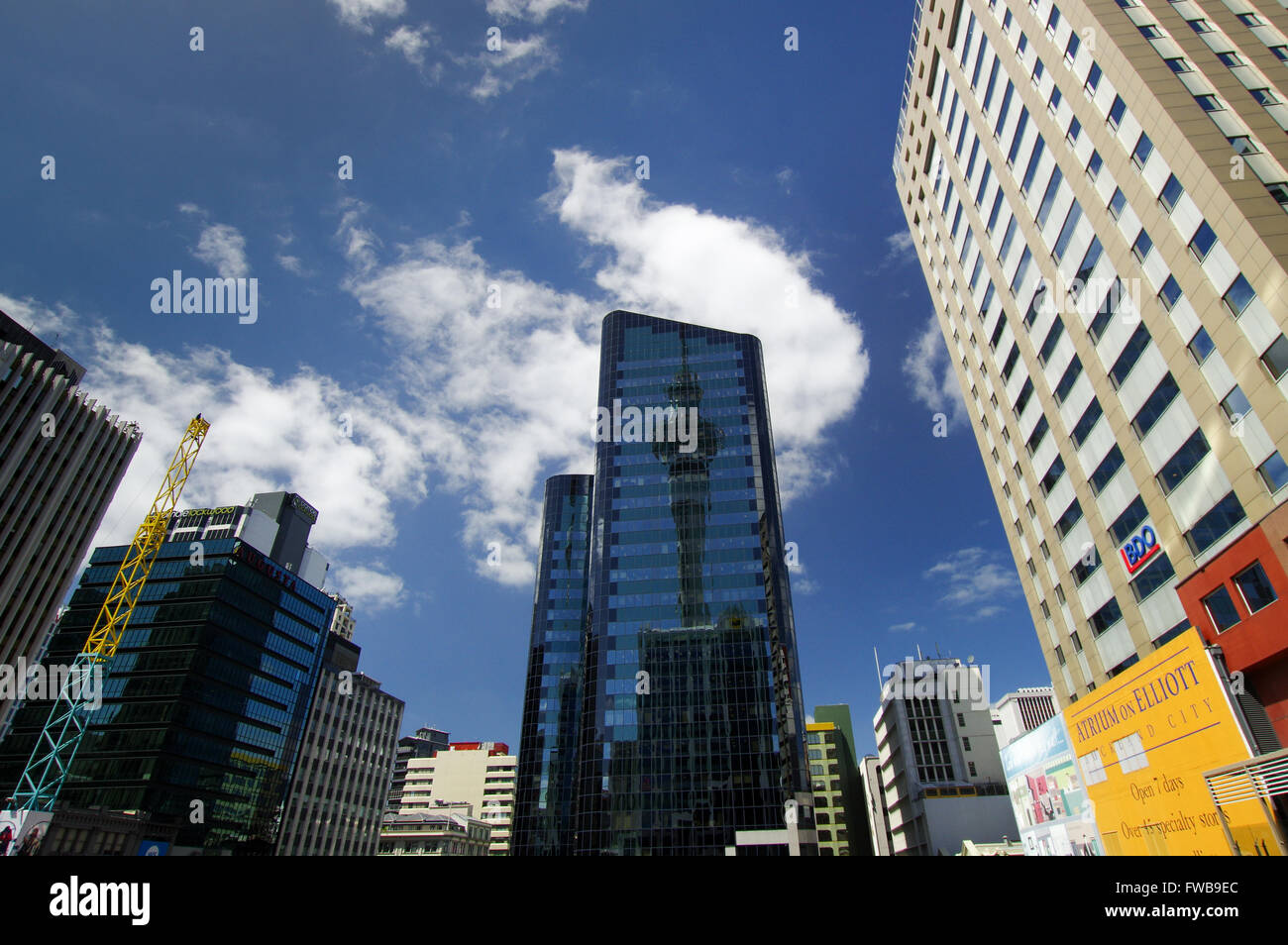 Sky Tower reflecting in the windows of ANZ building in Auckland Stock Photo