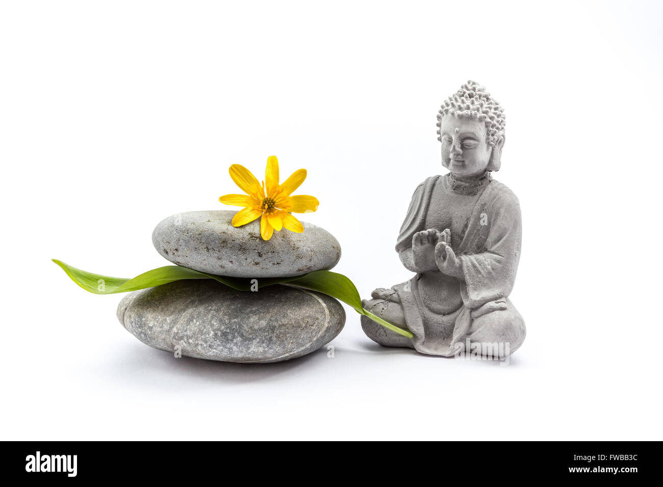 Pebbles with flower and an Buddha ,theme for Ayurveda on an white background  Stock Photo - Alamy