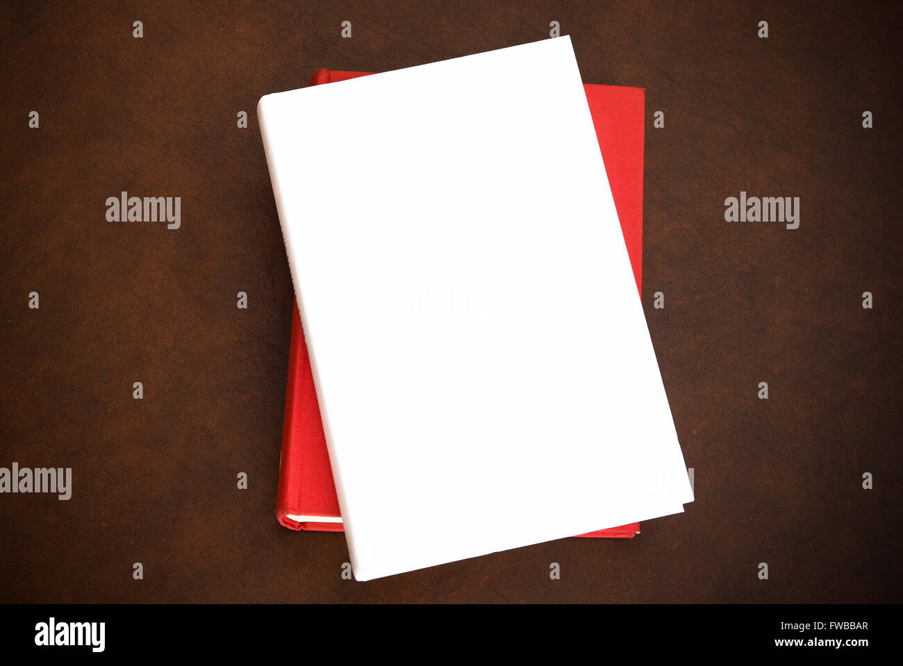 Books on wooden desktop with empty cover white copy space Stock Photo