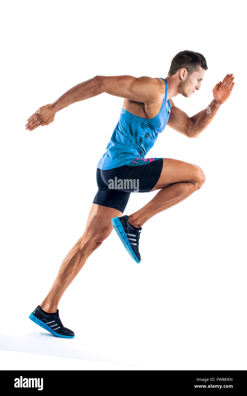 Full length portrait of a fitness man running isolated on a white background Stock Photo