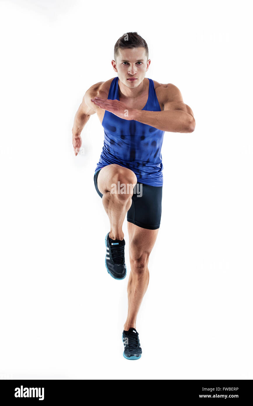 Full length portrait of a fitness man running isolated on a white background Stock Photo