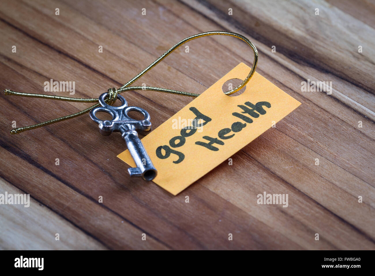 concept for a happy healthy life using an old decorative key and a hand ...