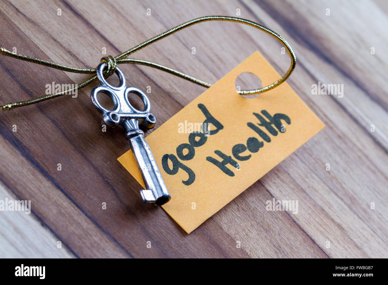concept for a happy healthy life using an old decorative key and a hand ...