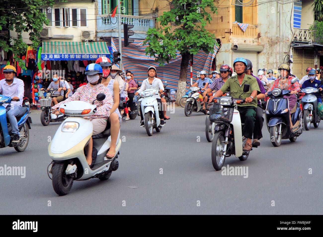 Vietnamese Motorcycle Rider Vietnamese people riding a motorbike in Hanoi, Vietnam, Asia Stock ...