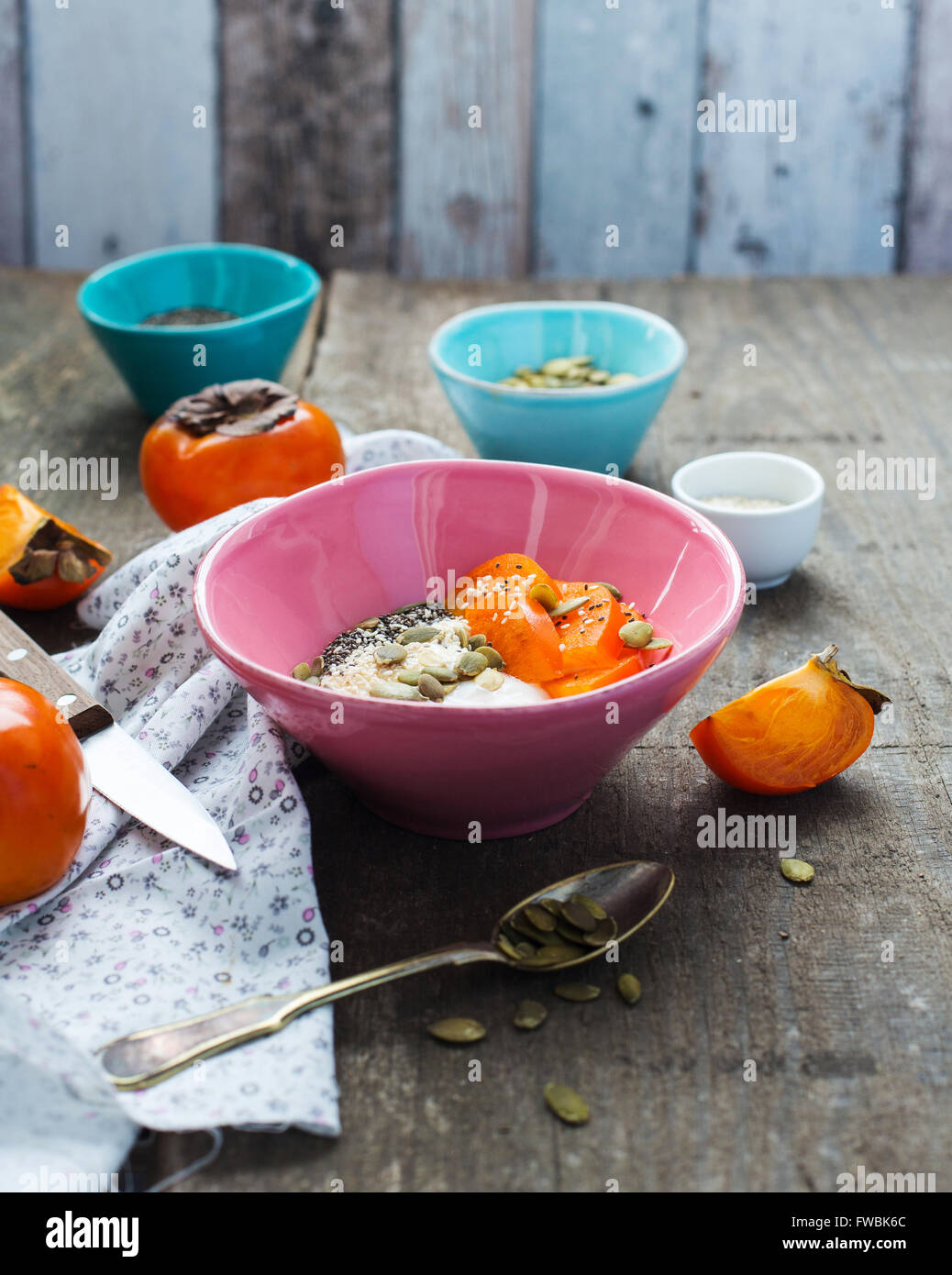 Breakfast bowl with yogurt, persimmon and superfoods Stock Photo Alamy