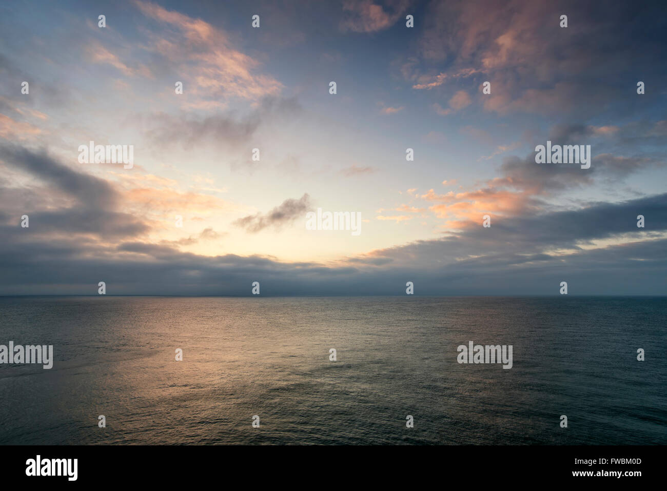 Beautiful colorful sunrise landscape over calm sea Stock Photo - Alamy