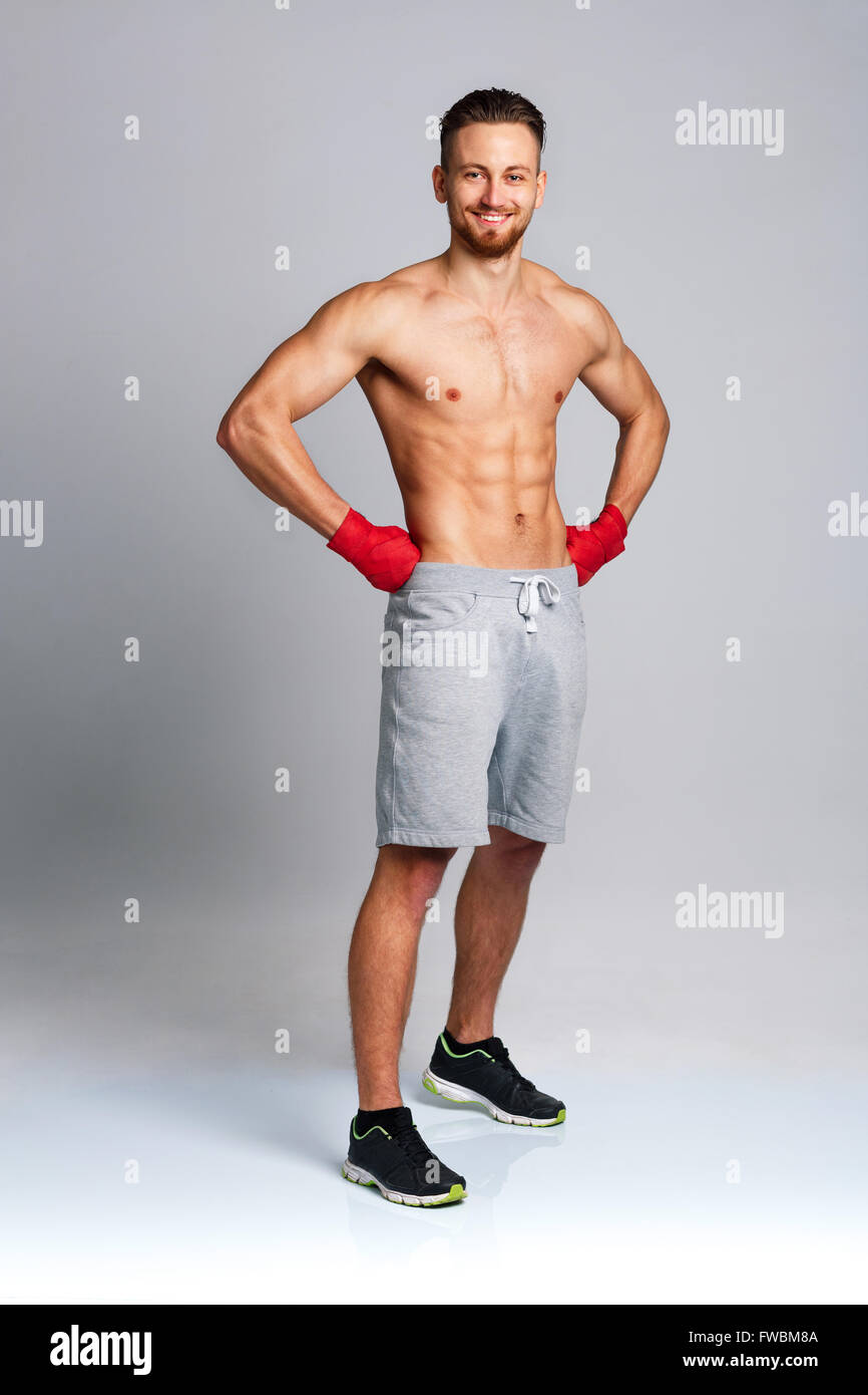 Athletic attractive man wearing boxing bandages Stock Photo