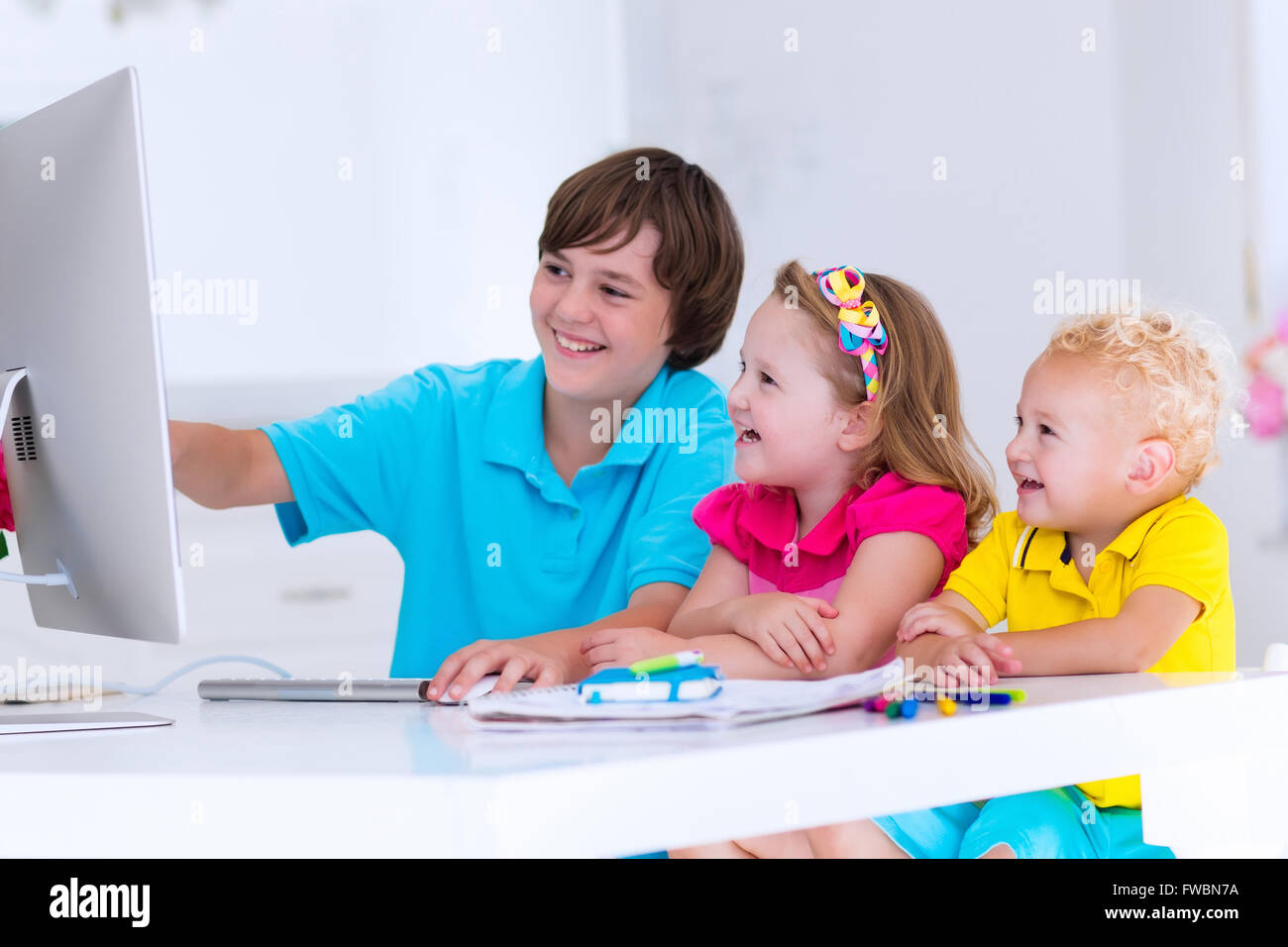 School kids working on personal computer at home. Student doing