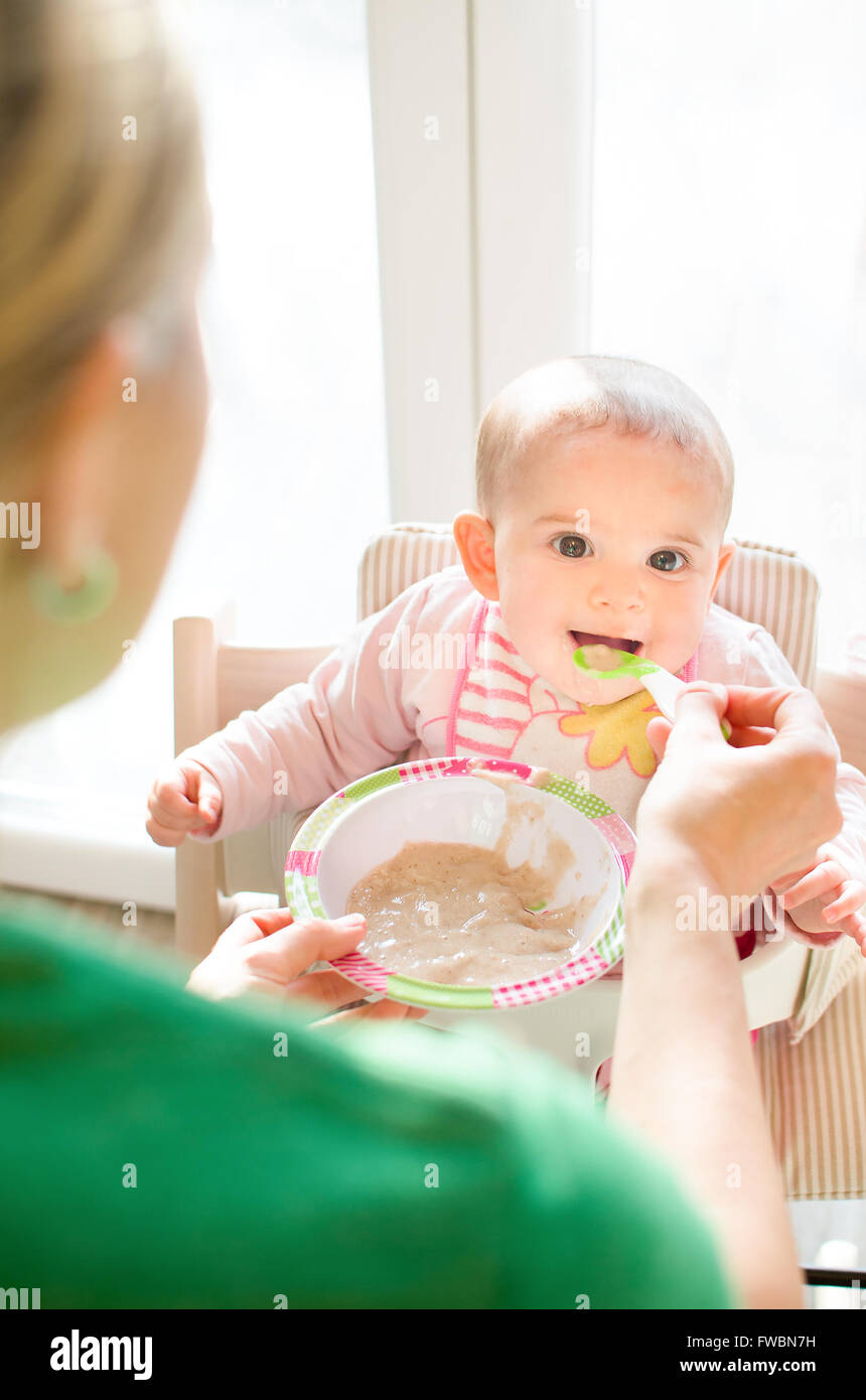 mother feed newborn weaning Stock Photo