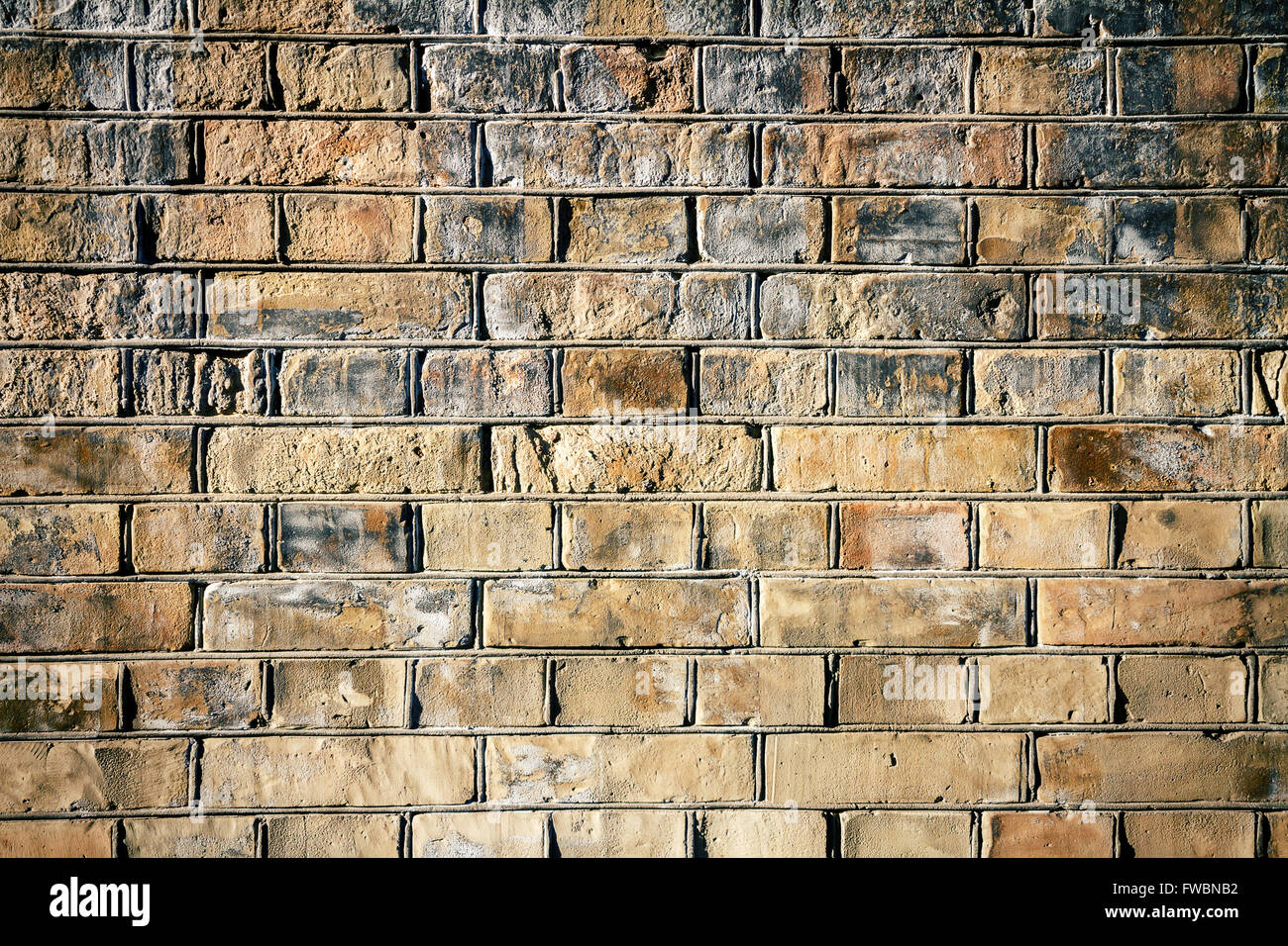 Background of yellow brick wall texture Stock Photo - Alamy