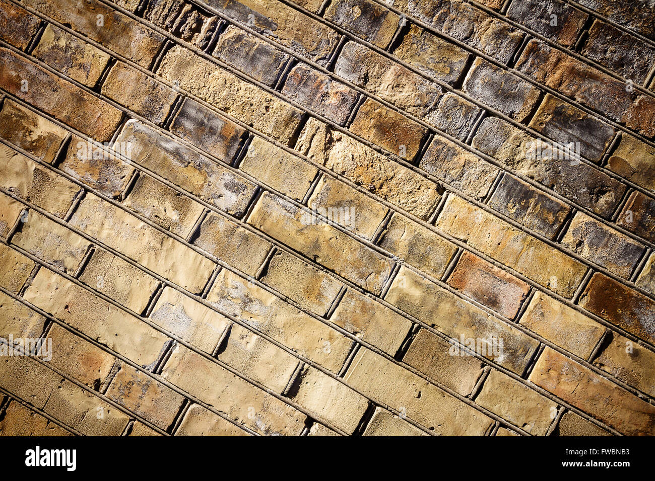 Background of yellow brick wall texture Stock Photo - Alamy