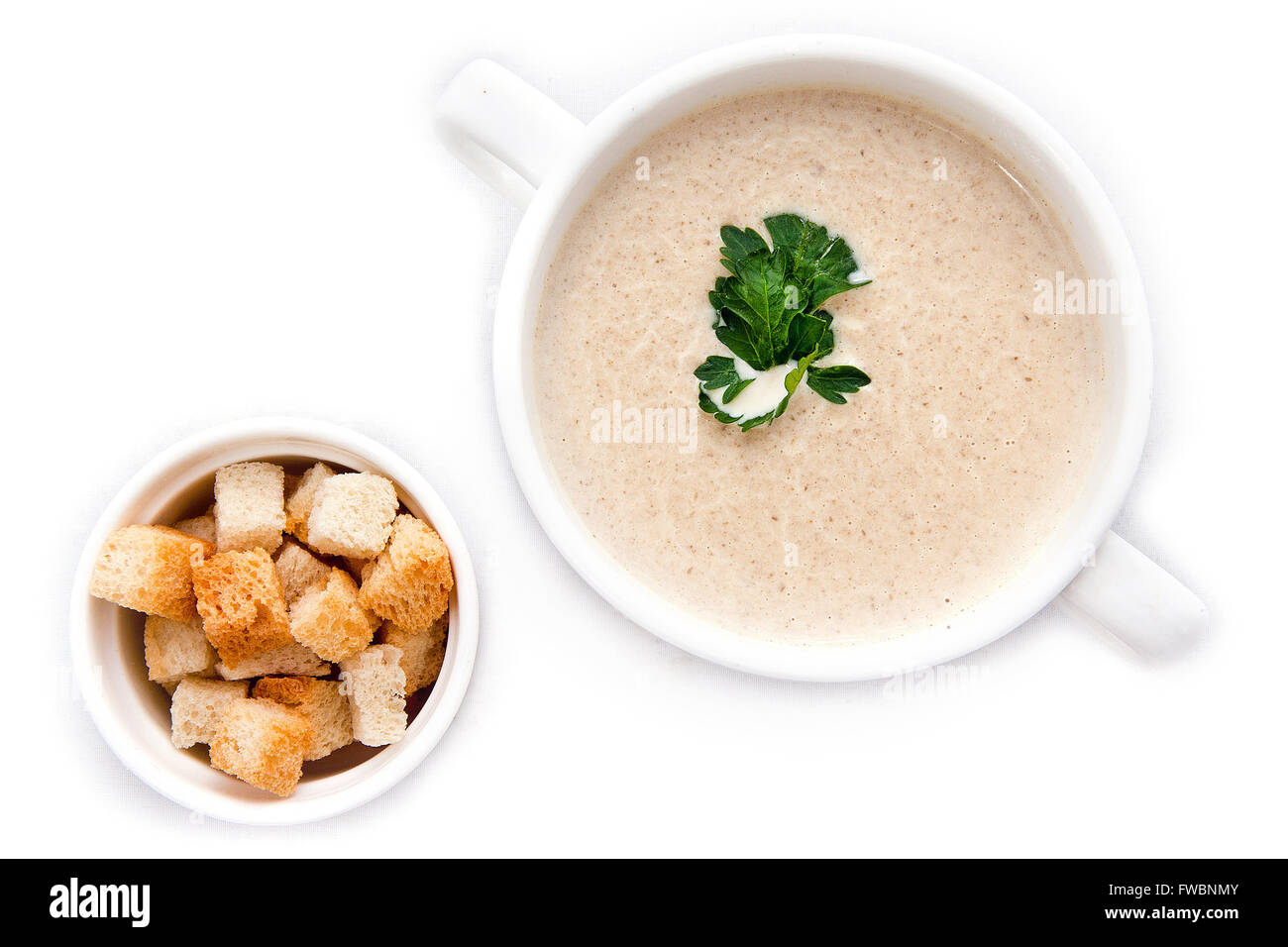 Mushroom cream soup isolated on white, top view Stock Photo