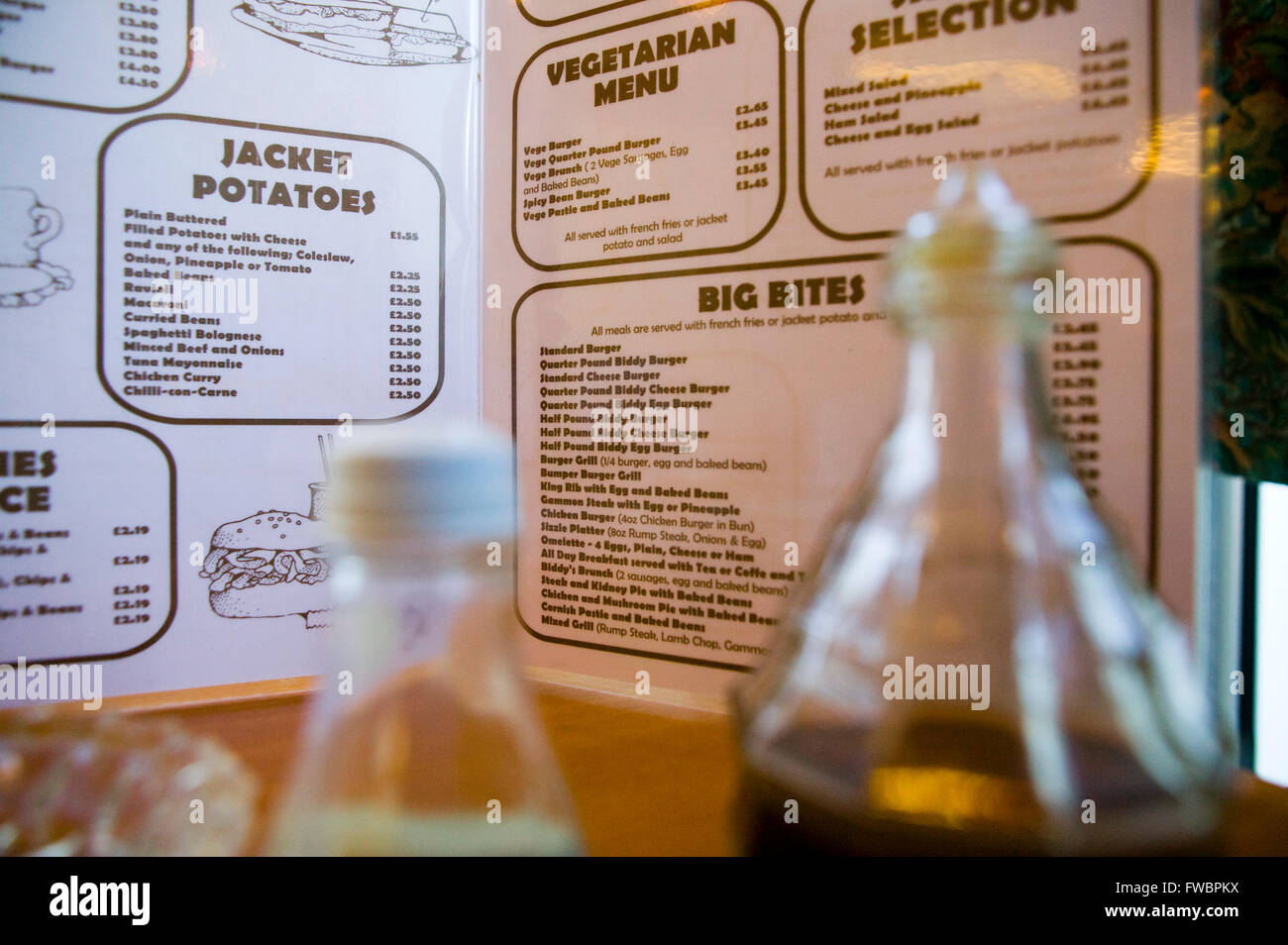 Close up of Cafe menu and condiments. Stock Photo