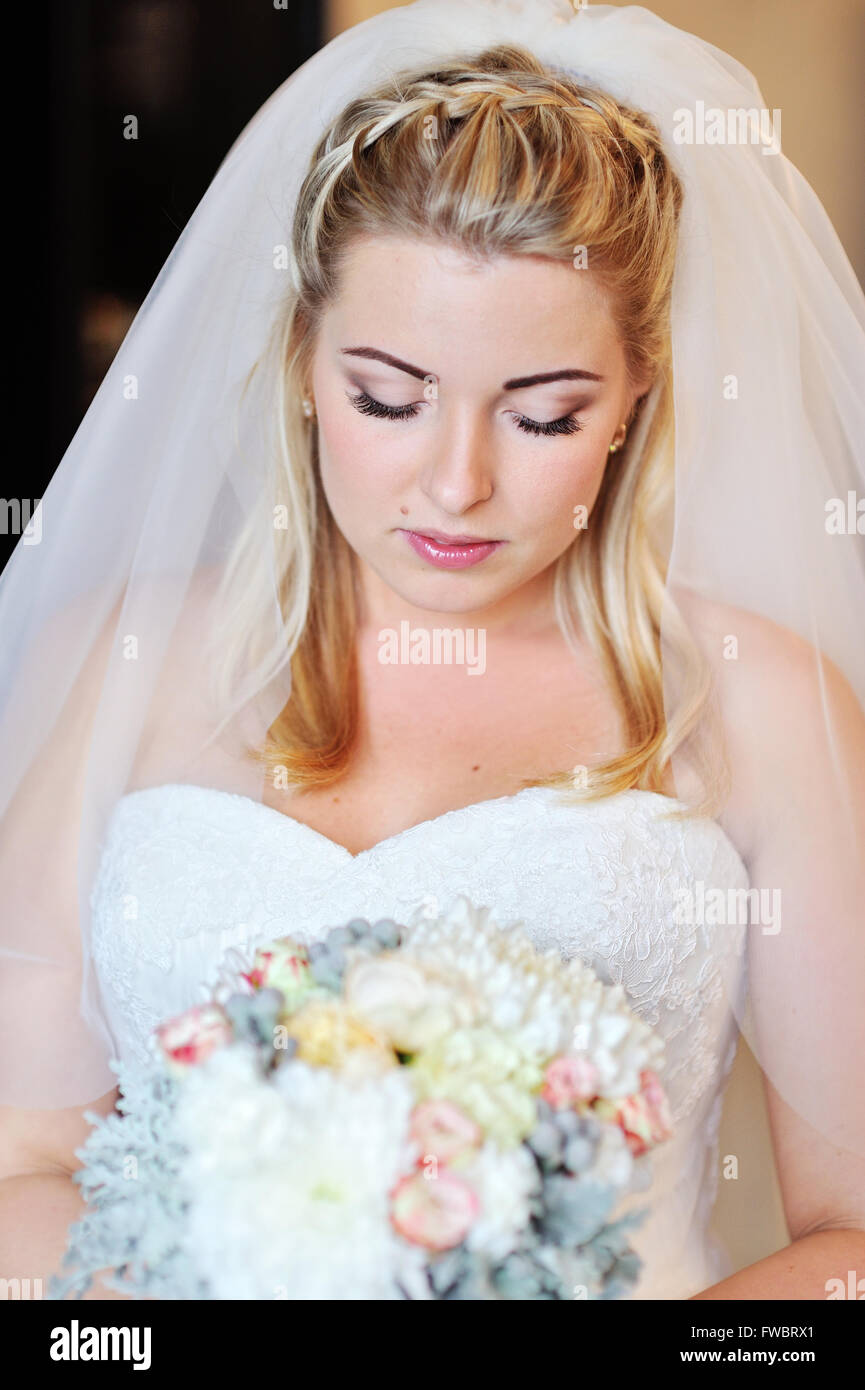 Beautiful bride holding bouquet hi-res stock photography and images - Alamy