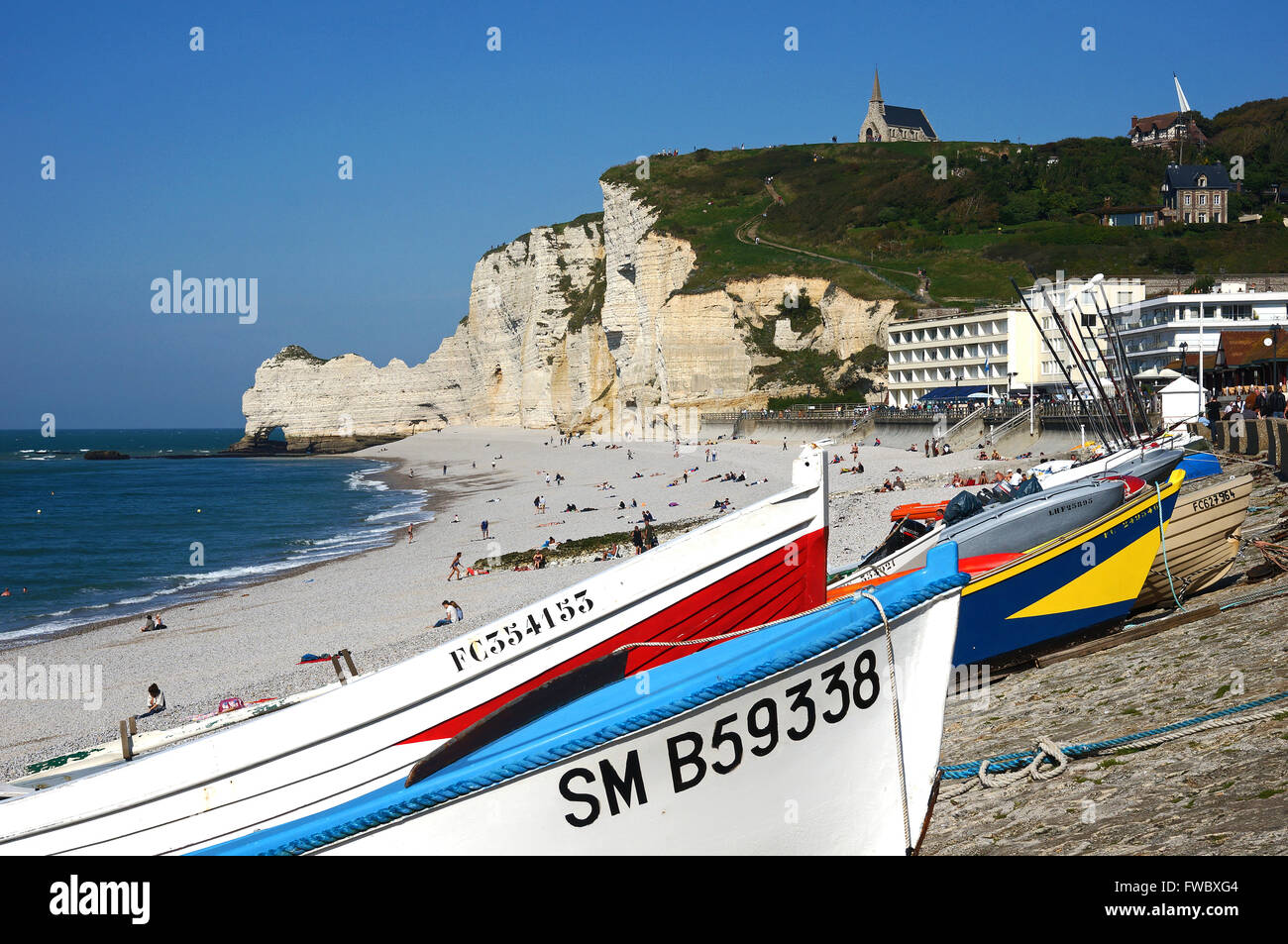 Coloured fishing boats on the beach of Etretat, Normandy, France Stock Photo