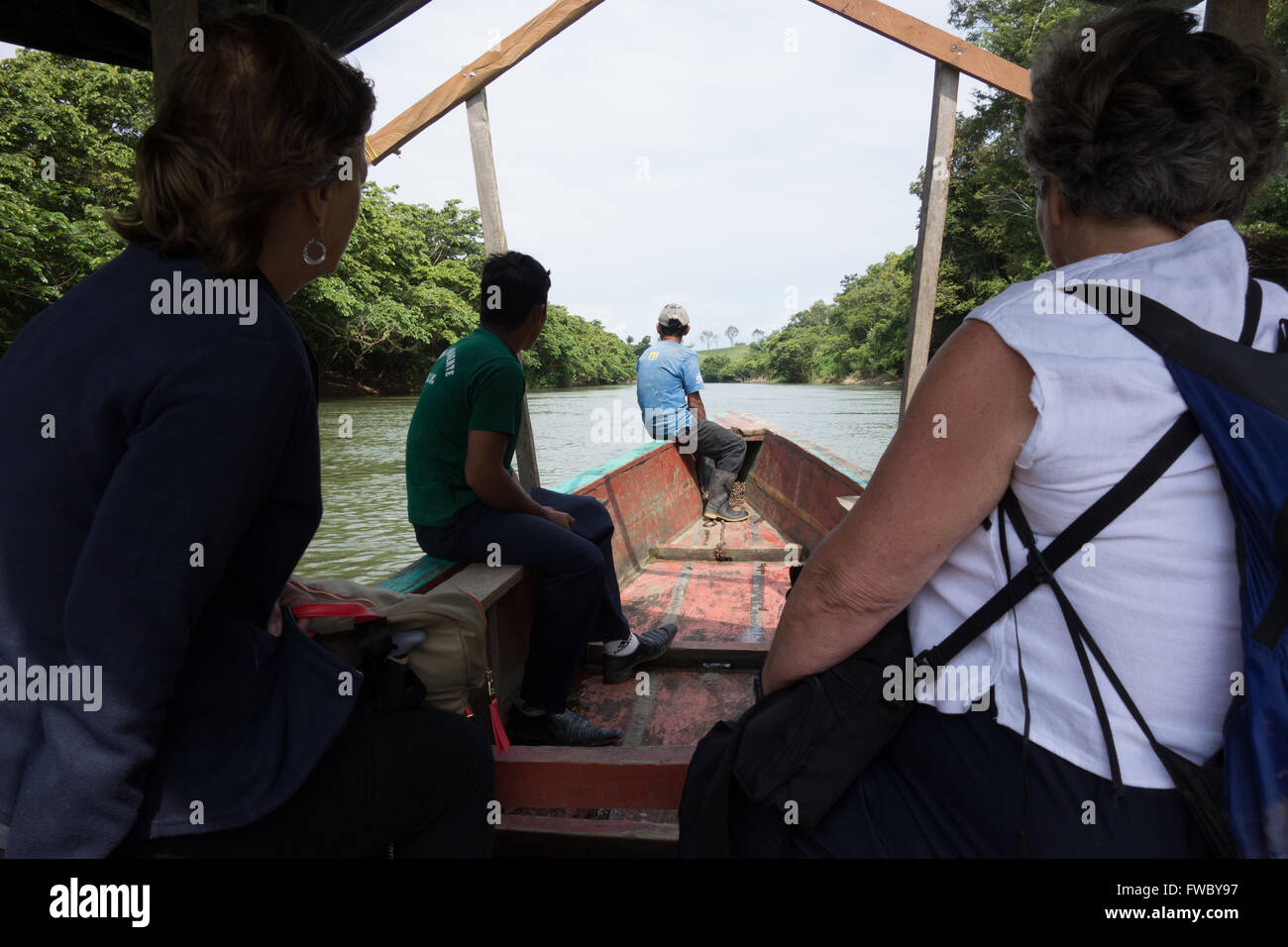 Tourists travelling on the Rio Pasion to reach the Mayan ruins of Cancuen, Guatemala Stock Photo