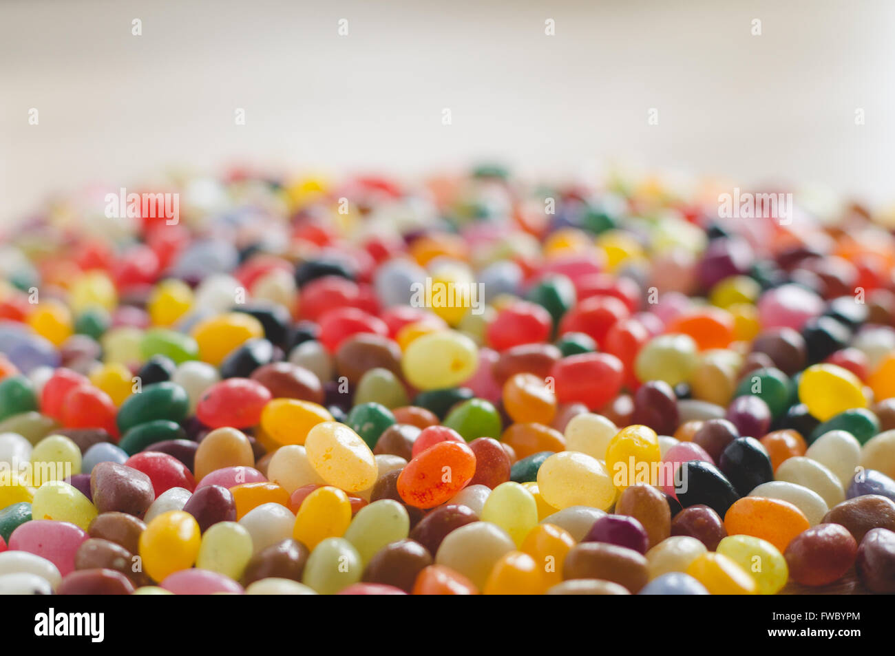 Colorful jelly beans sideview background with selective focus Stock