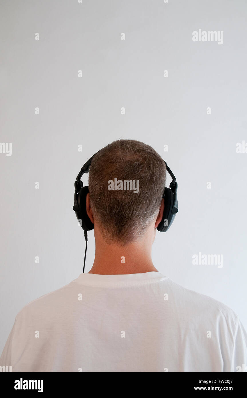 Man listening music using earphones Stock Photo Alamy