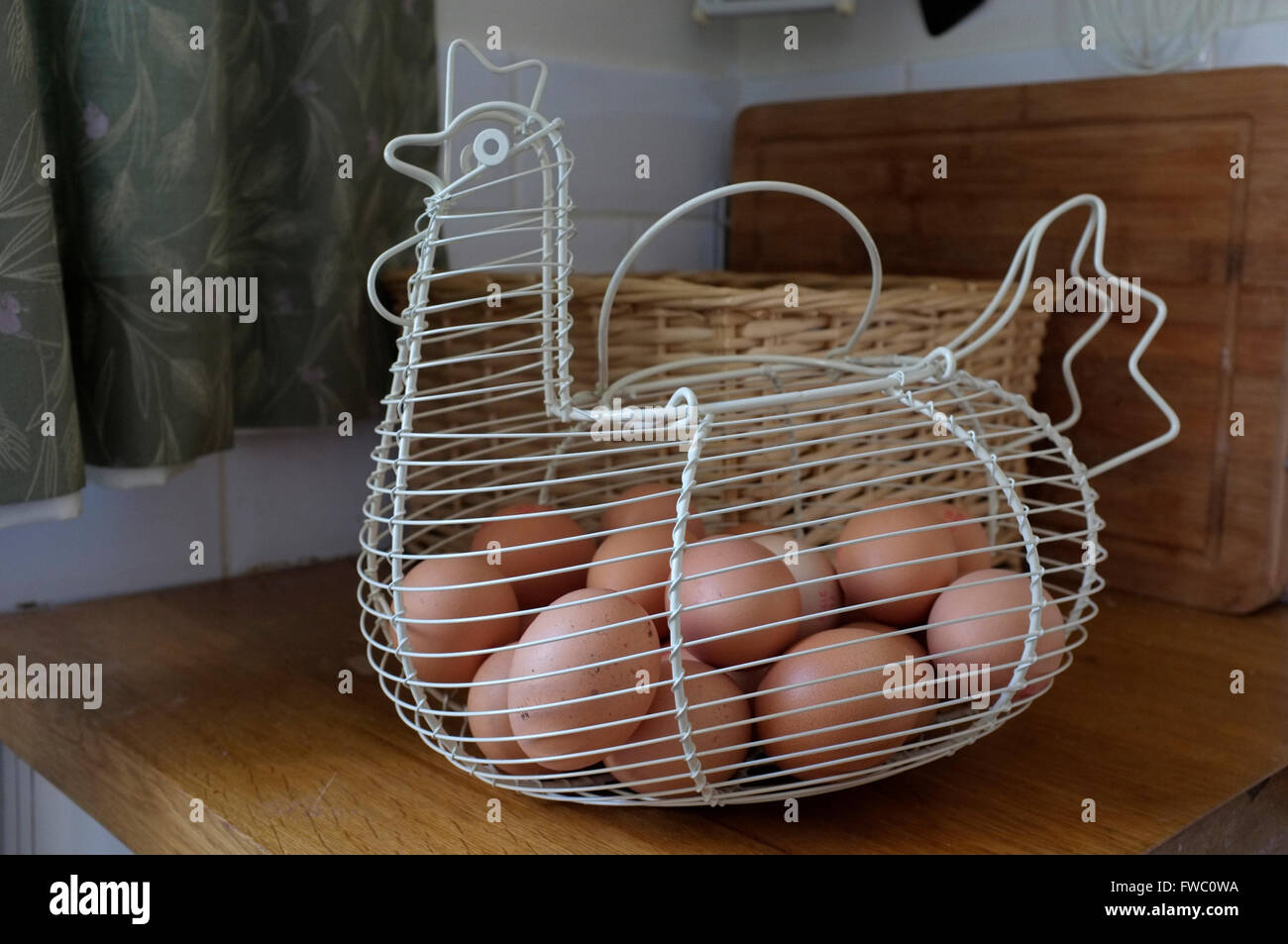 chicken egg wire carrying basket in east kent uk april 2016 Stock Photo