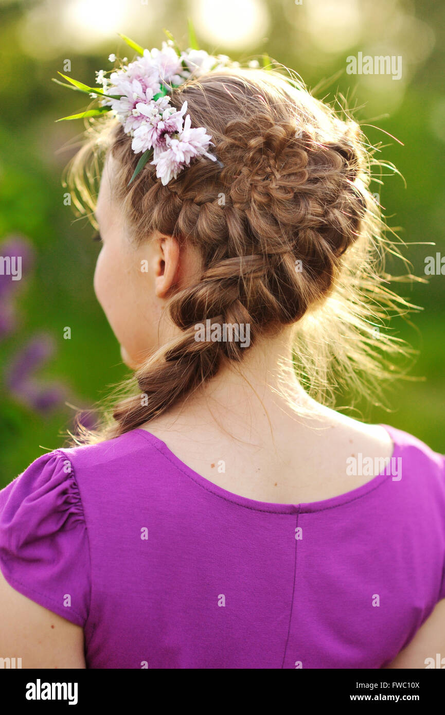 beautiful girl standing in the park. View from the back Stock Photo