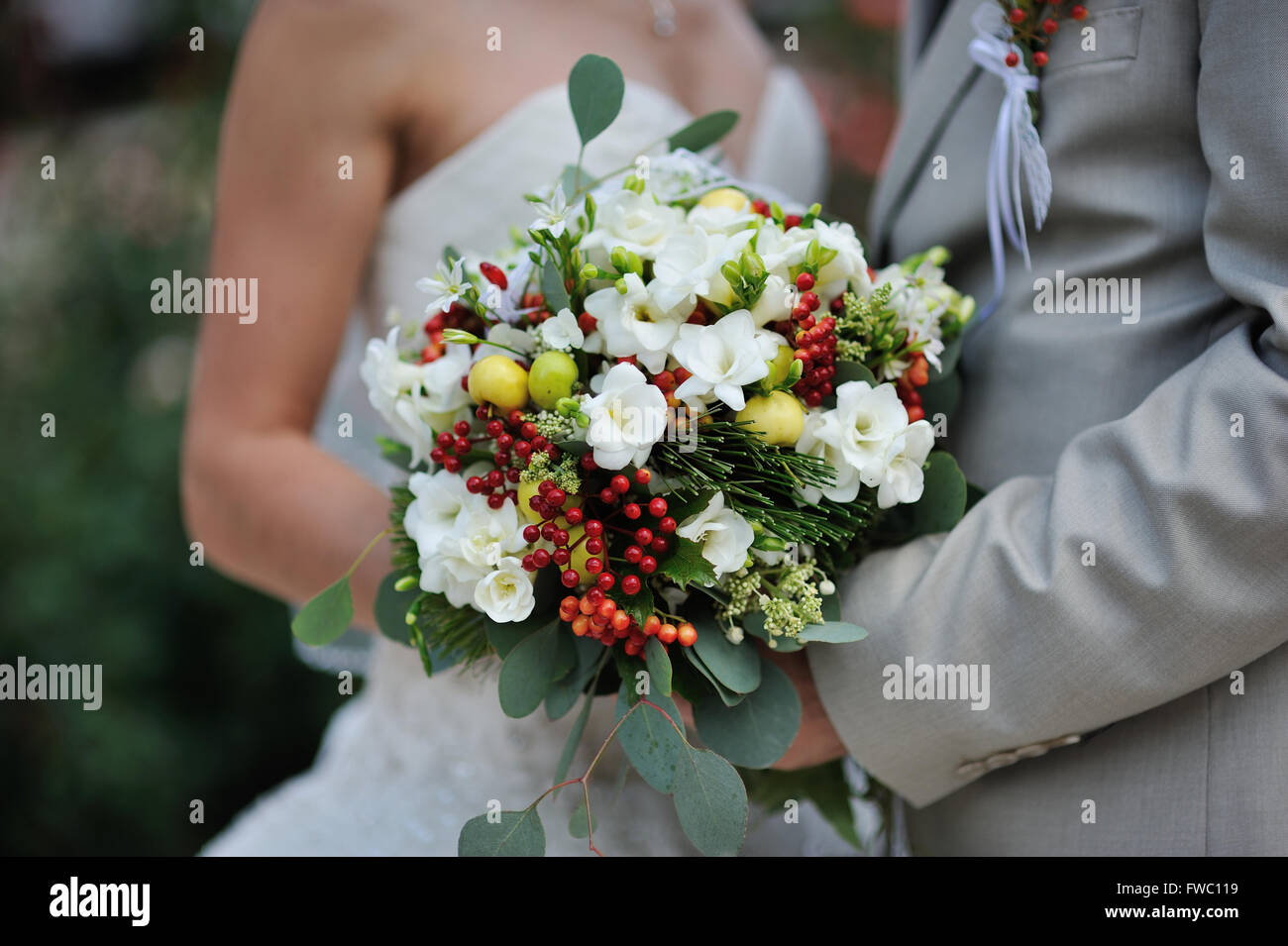 bride holding wedding bouquet with white flowers Stock Photo - Alamy