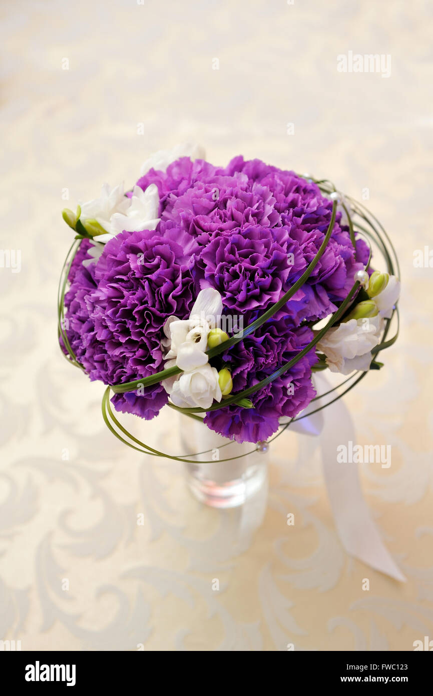 white and purple flowers on the wedding table Stock Photo