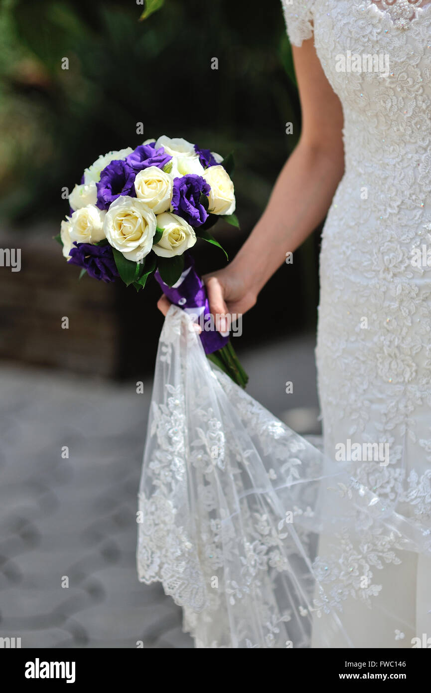Bride hold wedding bouquet with white and lilac roses Stock Photo Alamy
