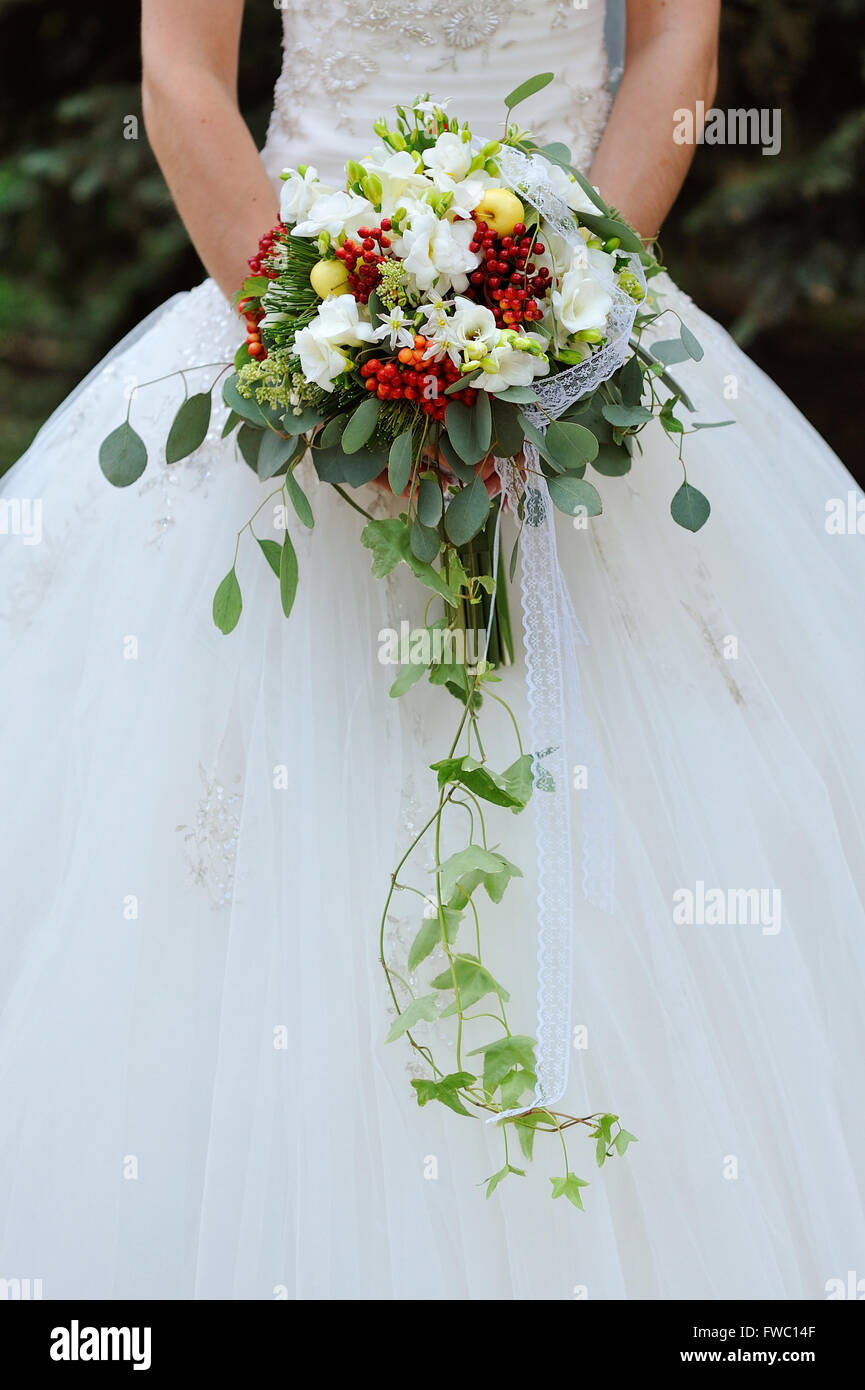bride holding wedding bouquet with white flowers Stock Photo - Alamy