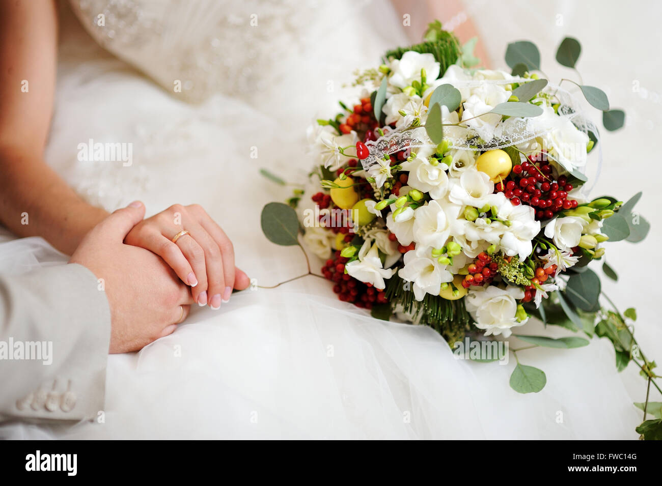 bride holding wedding bouquet with white flowers Stock Photo - Alamy