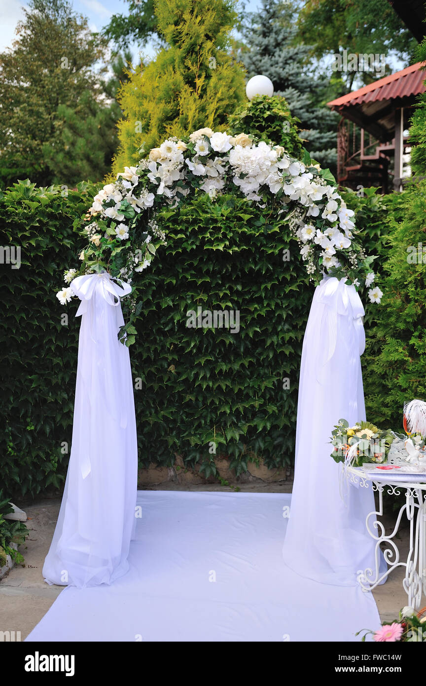 wedding arch with white flowers Stock Photo