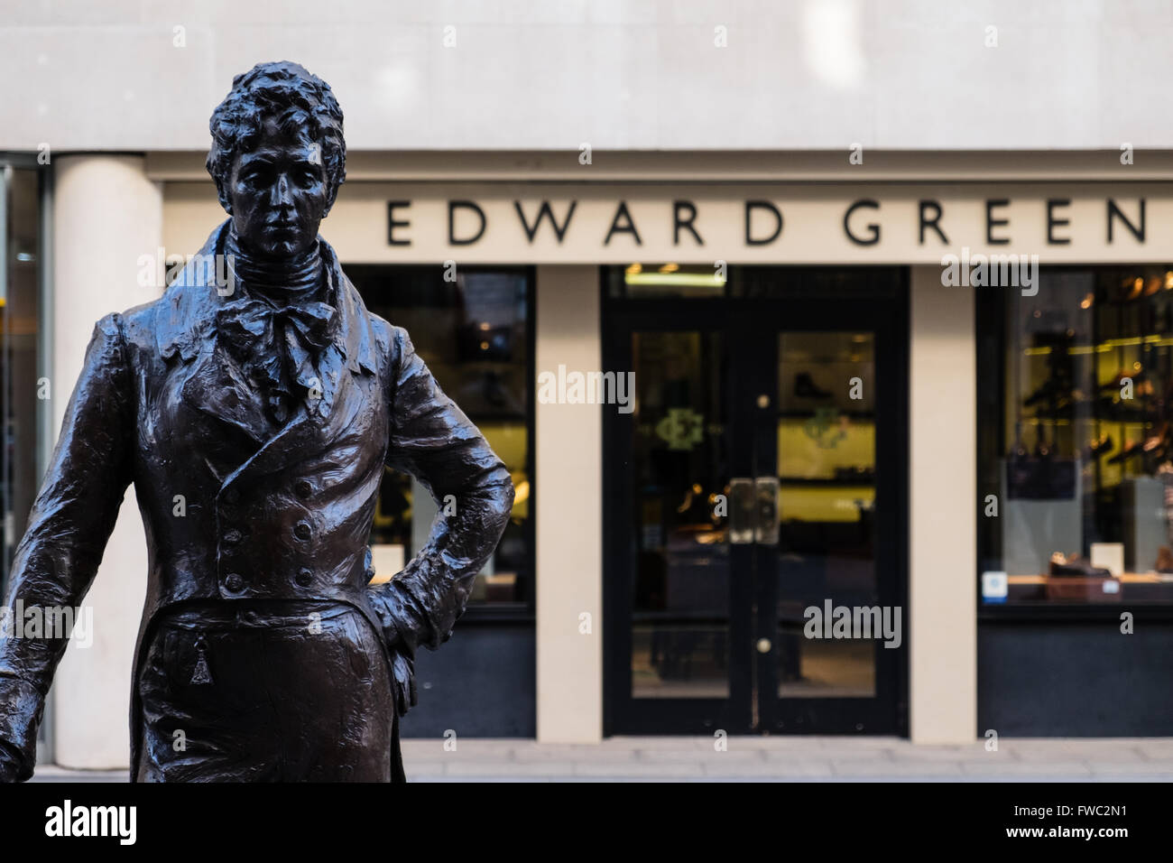 Beau Brummell in front of Edward Green Luxury shop windows on Jermyn Street in London Stock Photo