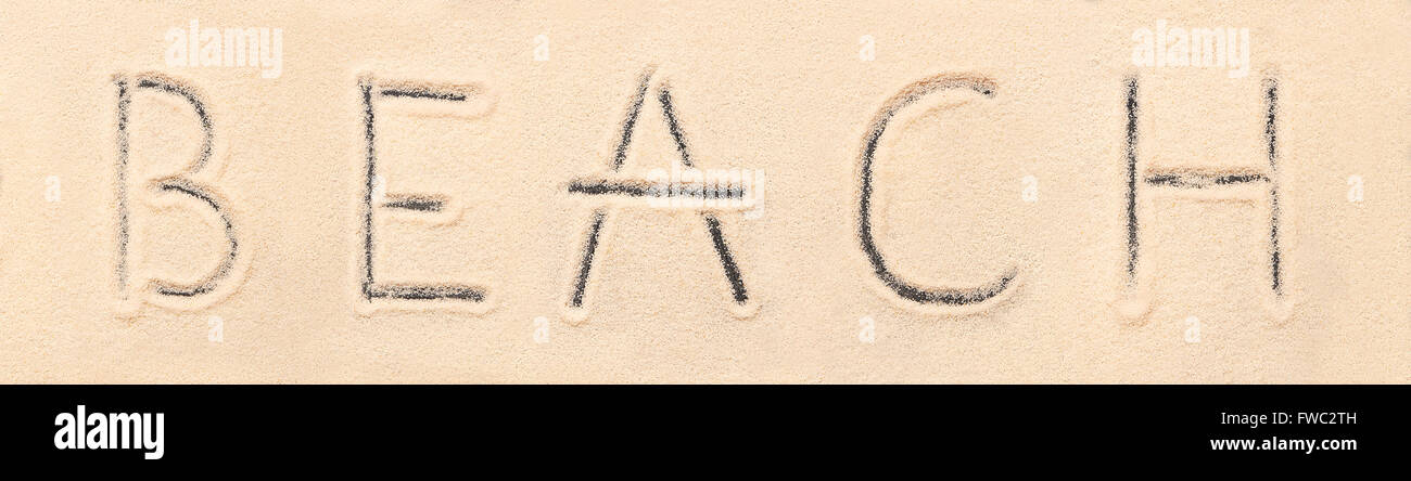 Beach lettering drawn on sand. Summer beach background Stock Photo - Alamy