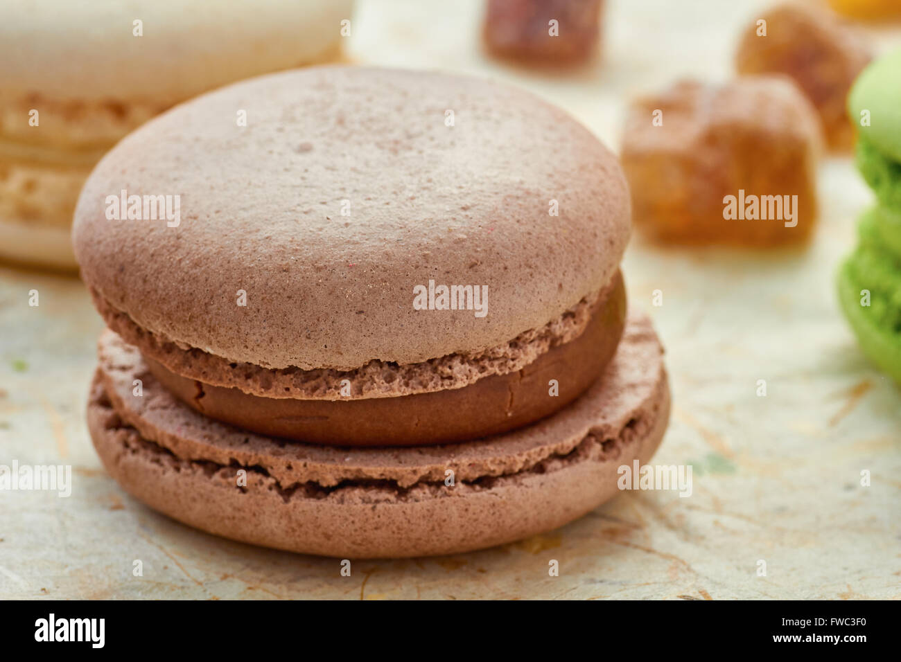 French brown macaron on wrapping-paper Stock Photo