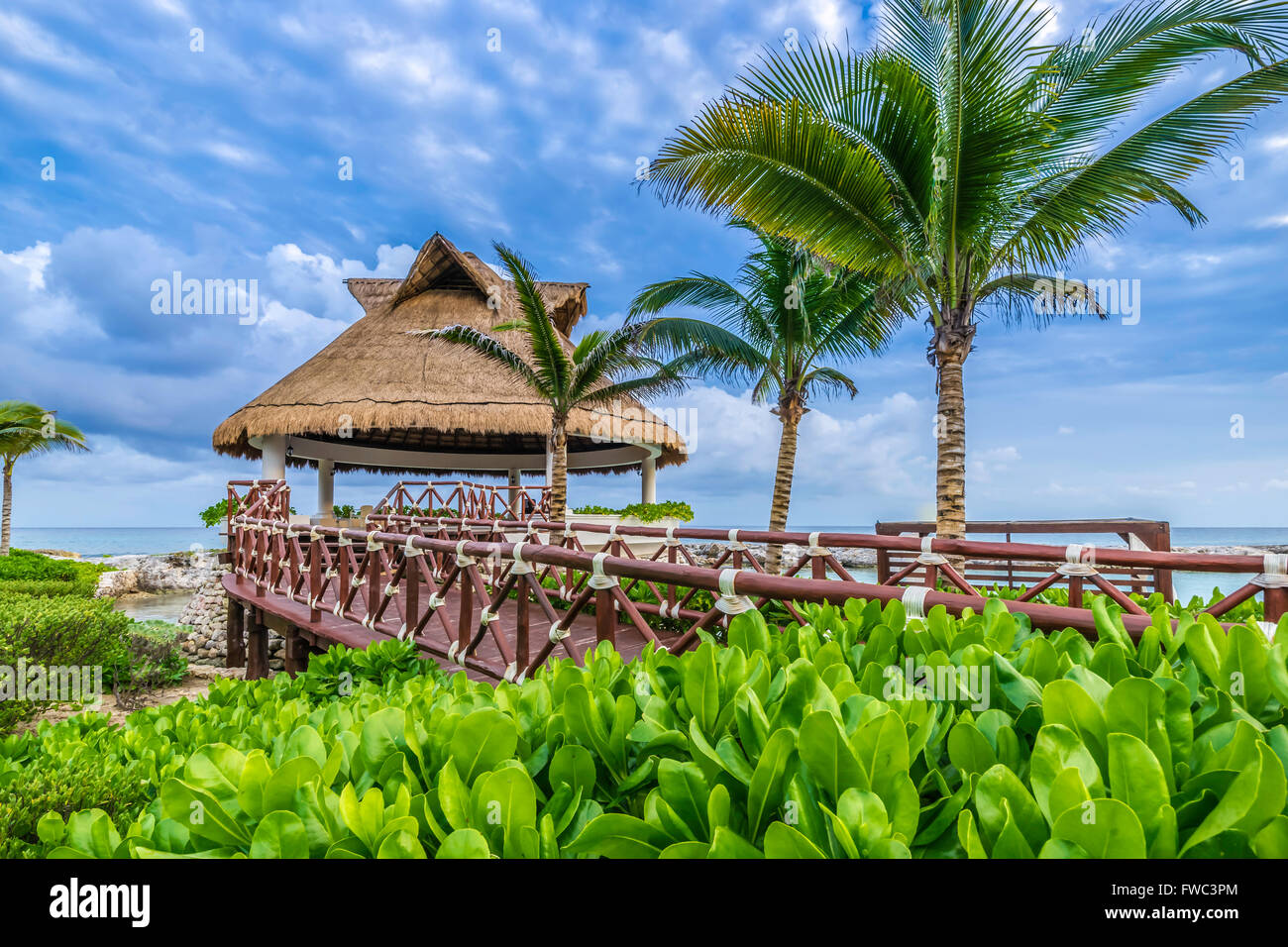 Thatched Cabana on the coast Stock Photo