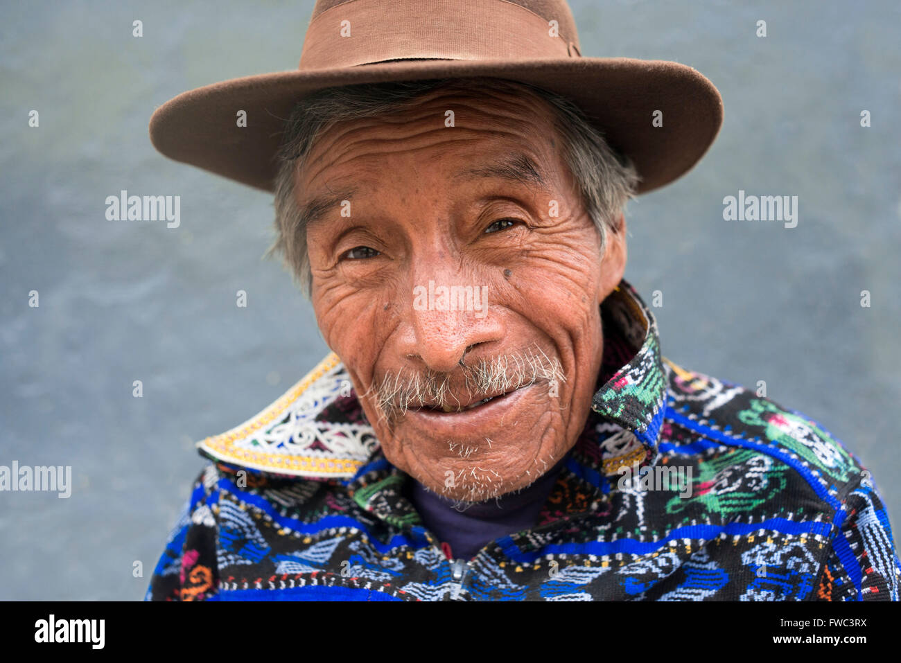 Portrait of a man in traditional dress remain in one of the streets of Chichicastenango, Guatemala. Stock Photo