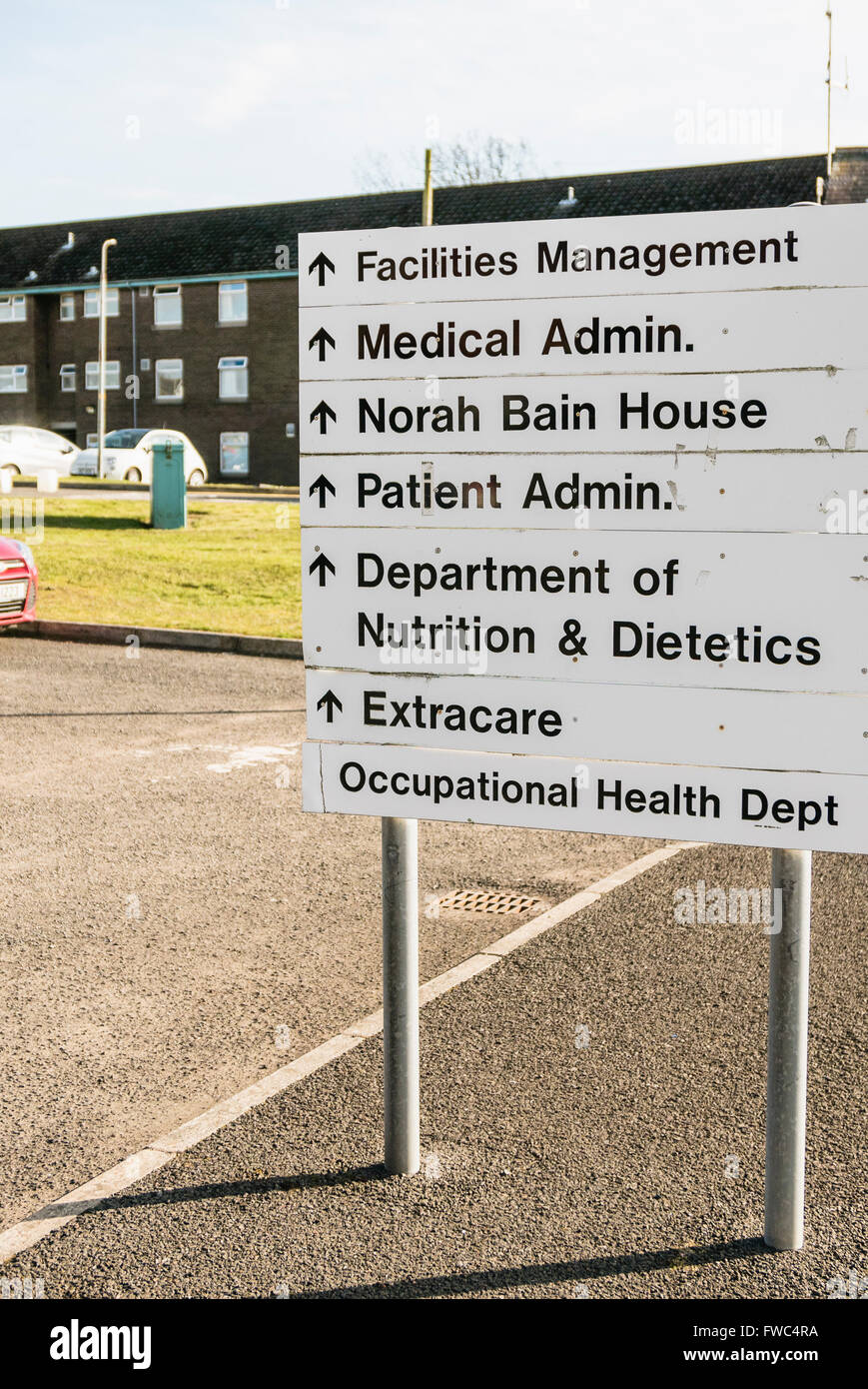 Sign at a hospital giving directions to various administration and service units including the Department of Nutrition and Diete Stock Photo