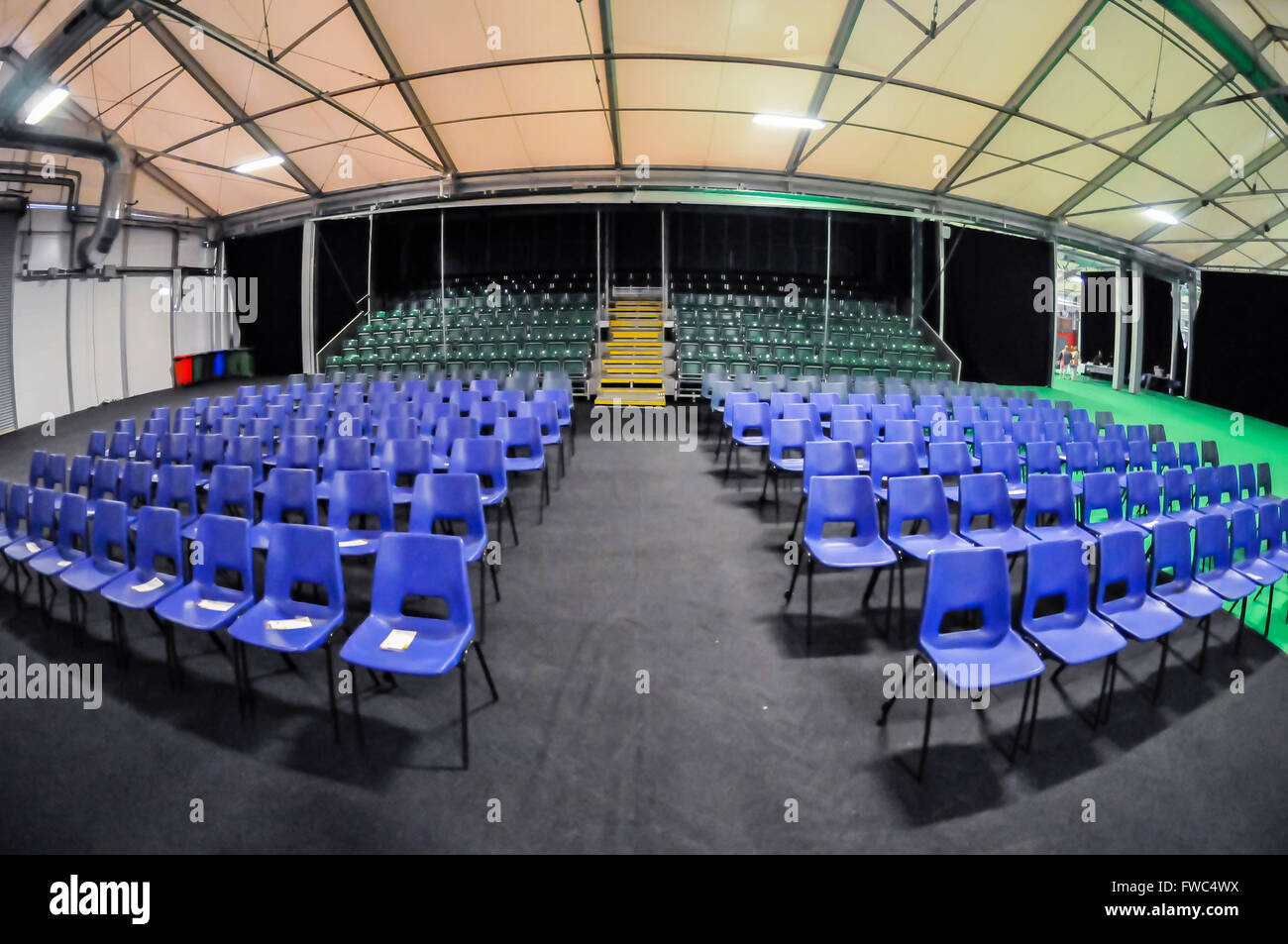 Empty chairs set out for a seminar in a conference centre, ready for the audience to arrive