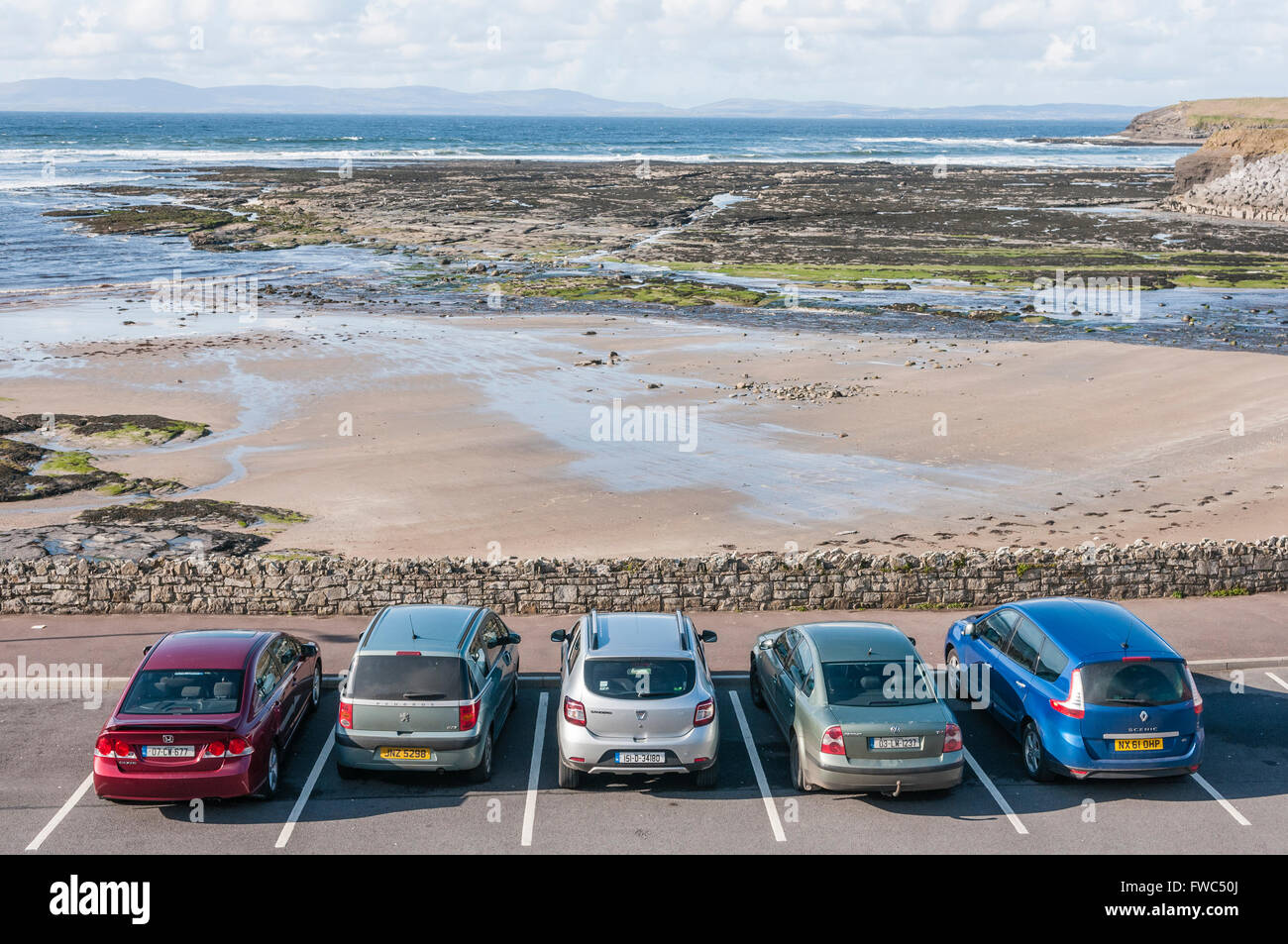 Five cars parked at a seaside car park Stock Photo Alamy