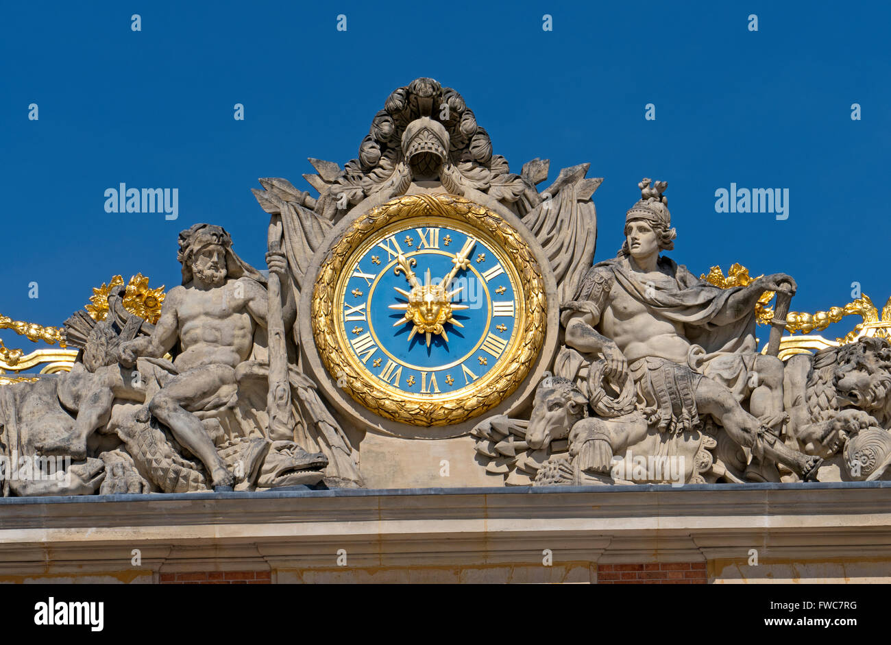 Statues of Hercules and Mars flank he clock overlooking the courtyard