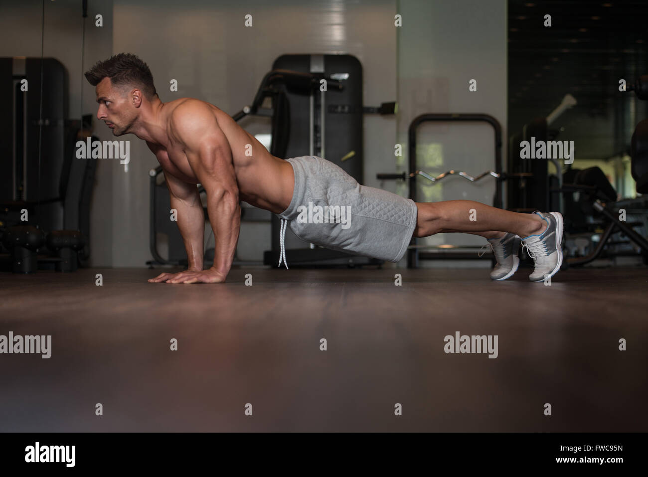 Young Man Athlete Doing Pushups As Part Of Bodybuilding Training Stock ...