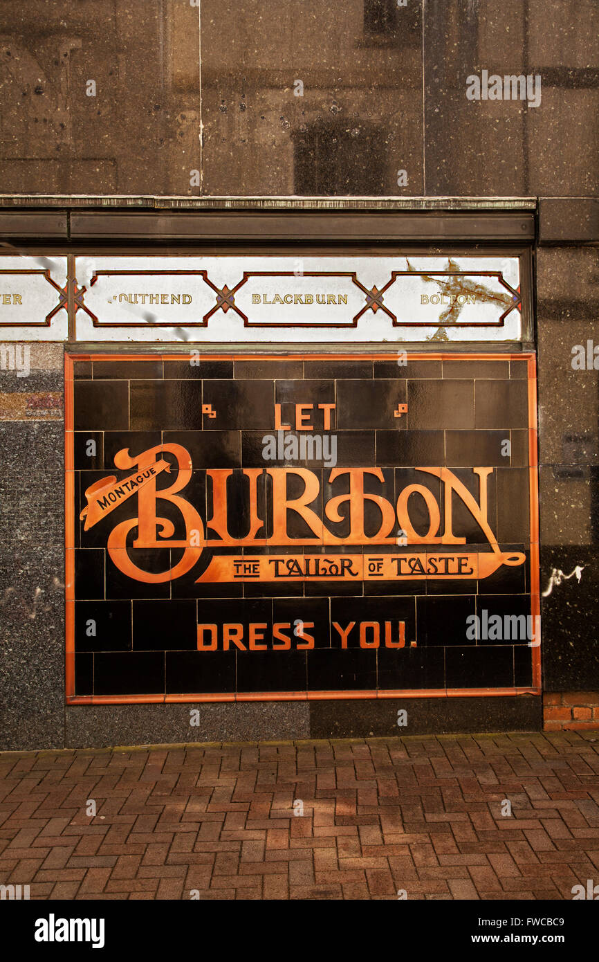 Advertisement for Burton the tailor  in tiles on the wall of their shop in Abergavenny Wales Stock Photo