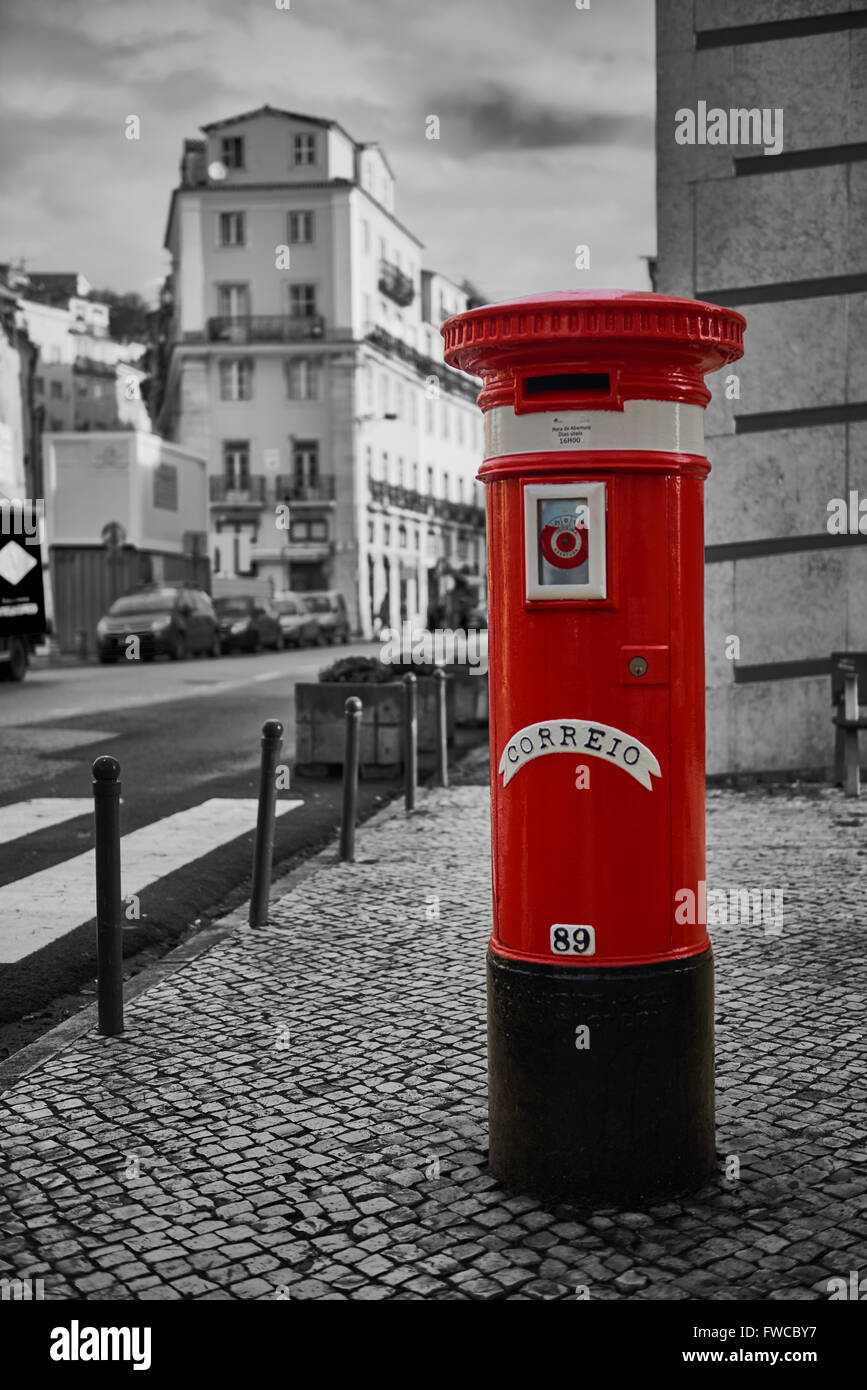 Black and White Image with the Red Color Box Mail in Lisbon, Portugal, Europe Stock Photo