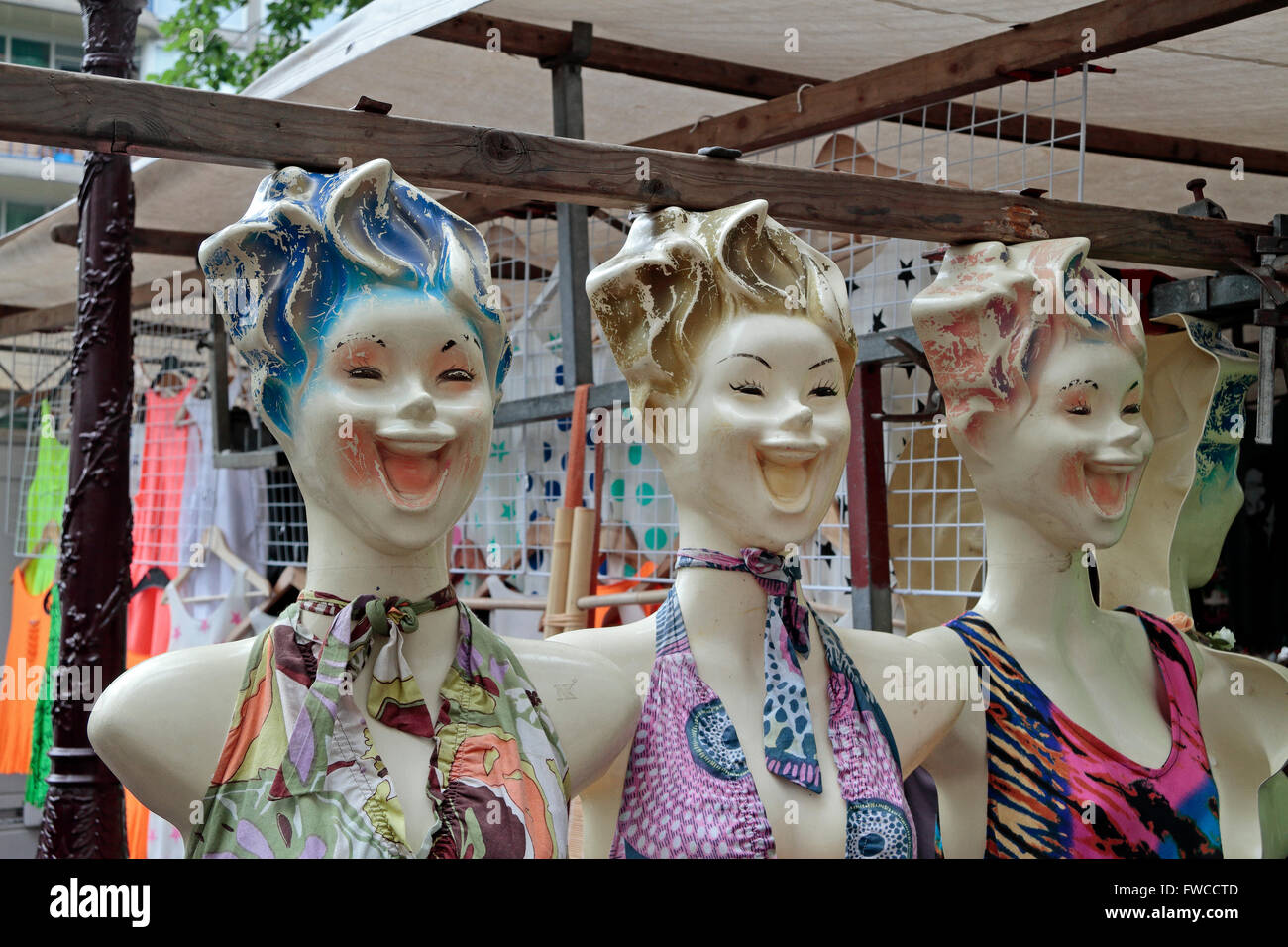 Three creepy looking mannequin faces on a market stall in Amsterdam, Netherlands. Stock Photo