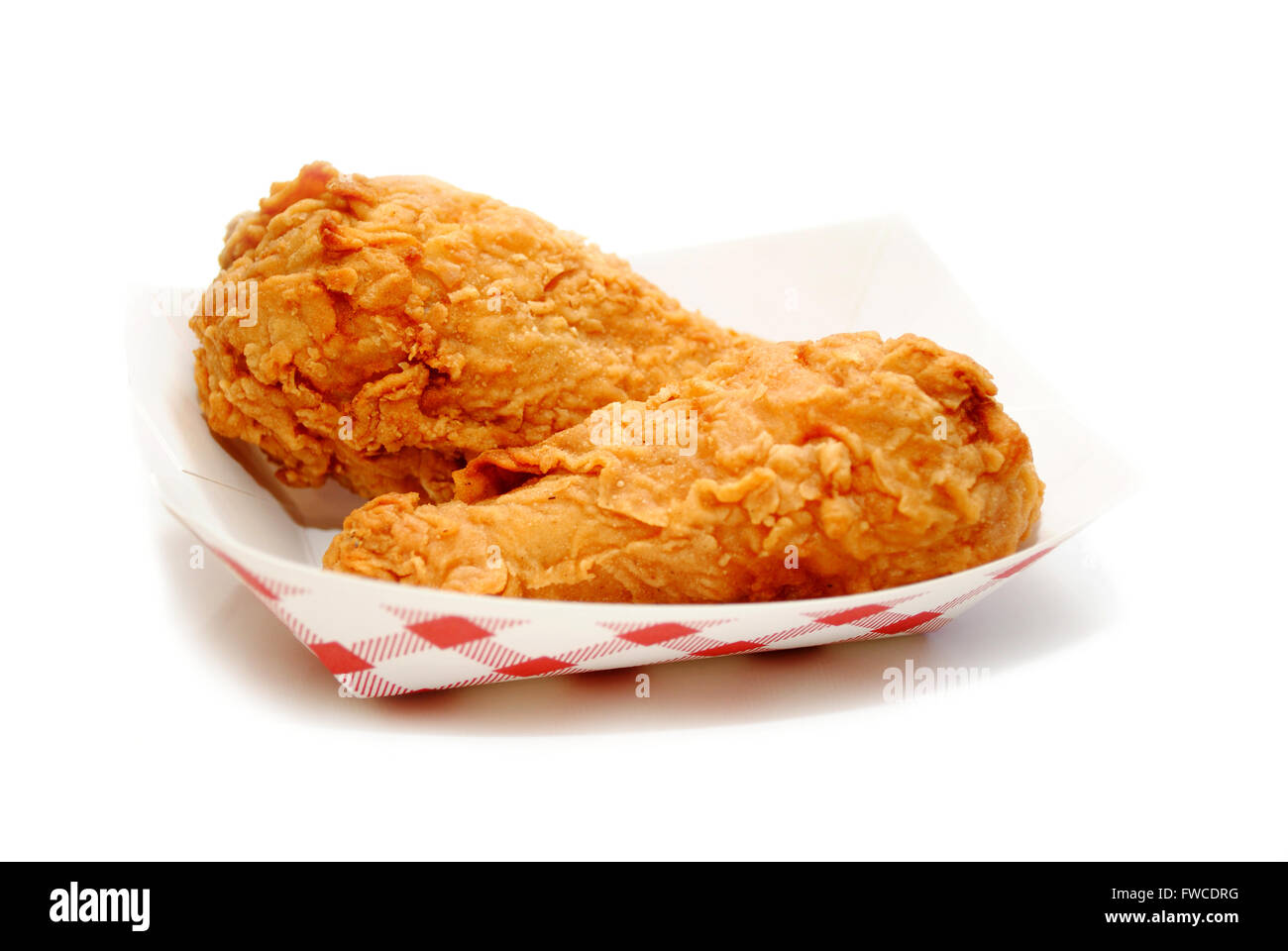 Fried Chicken Legs in a Take Out Container Stock Photo