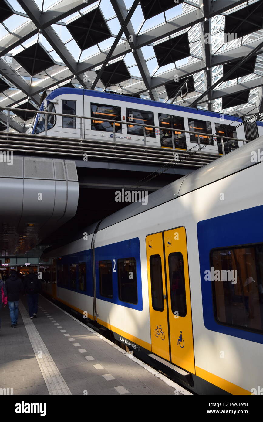 NS train and Randstadrail tram at the Den Haag Station Stock Photo
